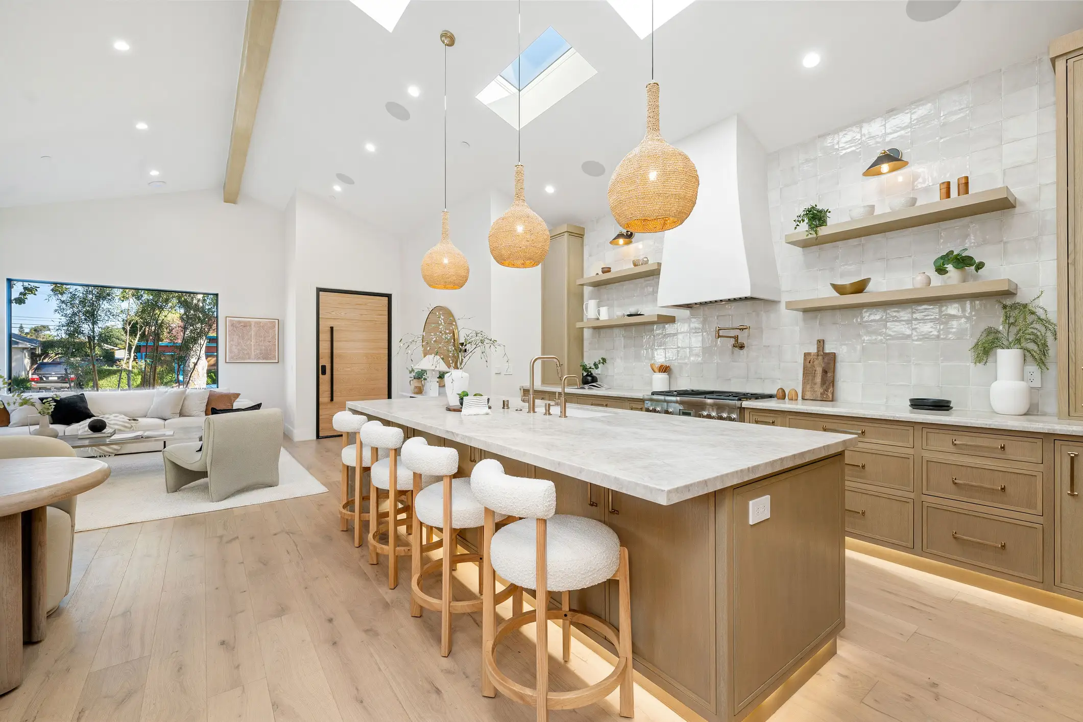 kitchen interior with wooden cabinets and island, boucle countertop chairs, open shelving