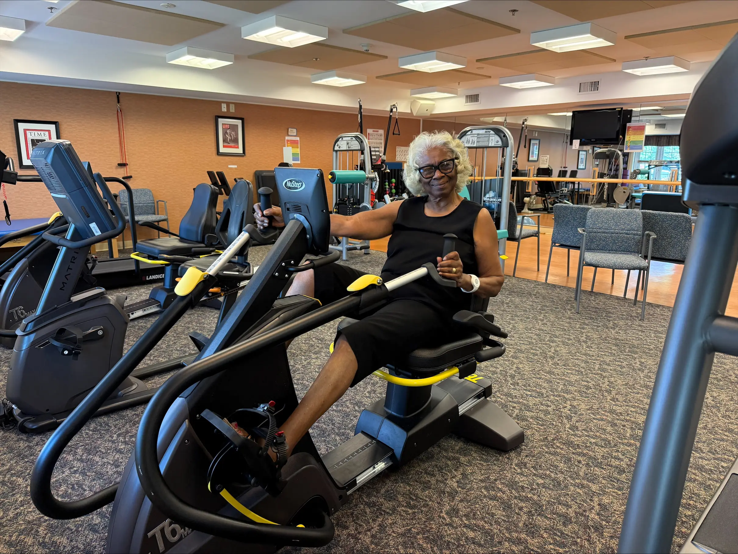 a woman exercises on a machine