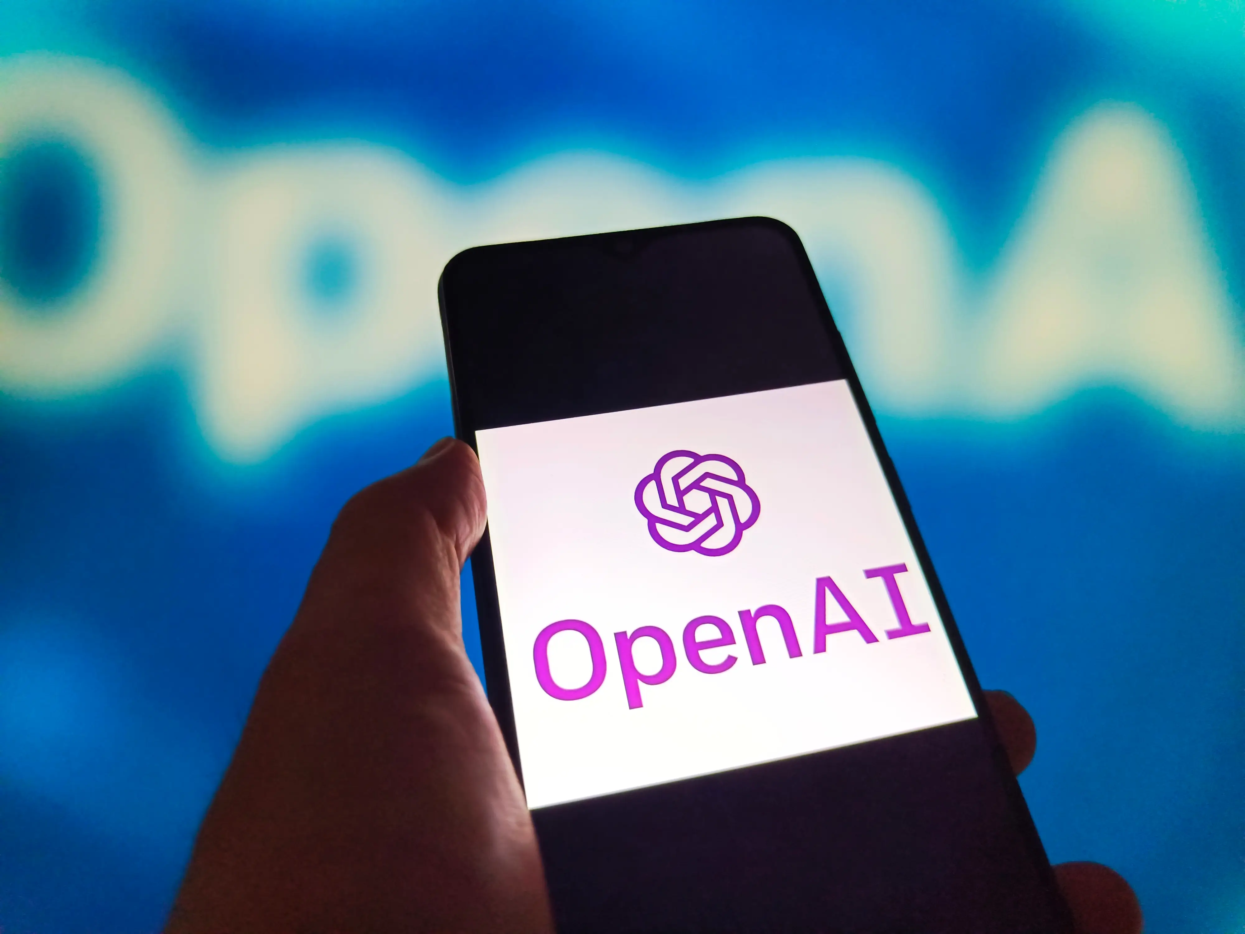 OpenAI logo on a phone.