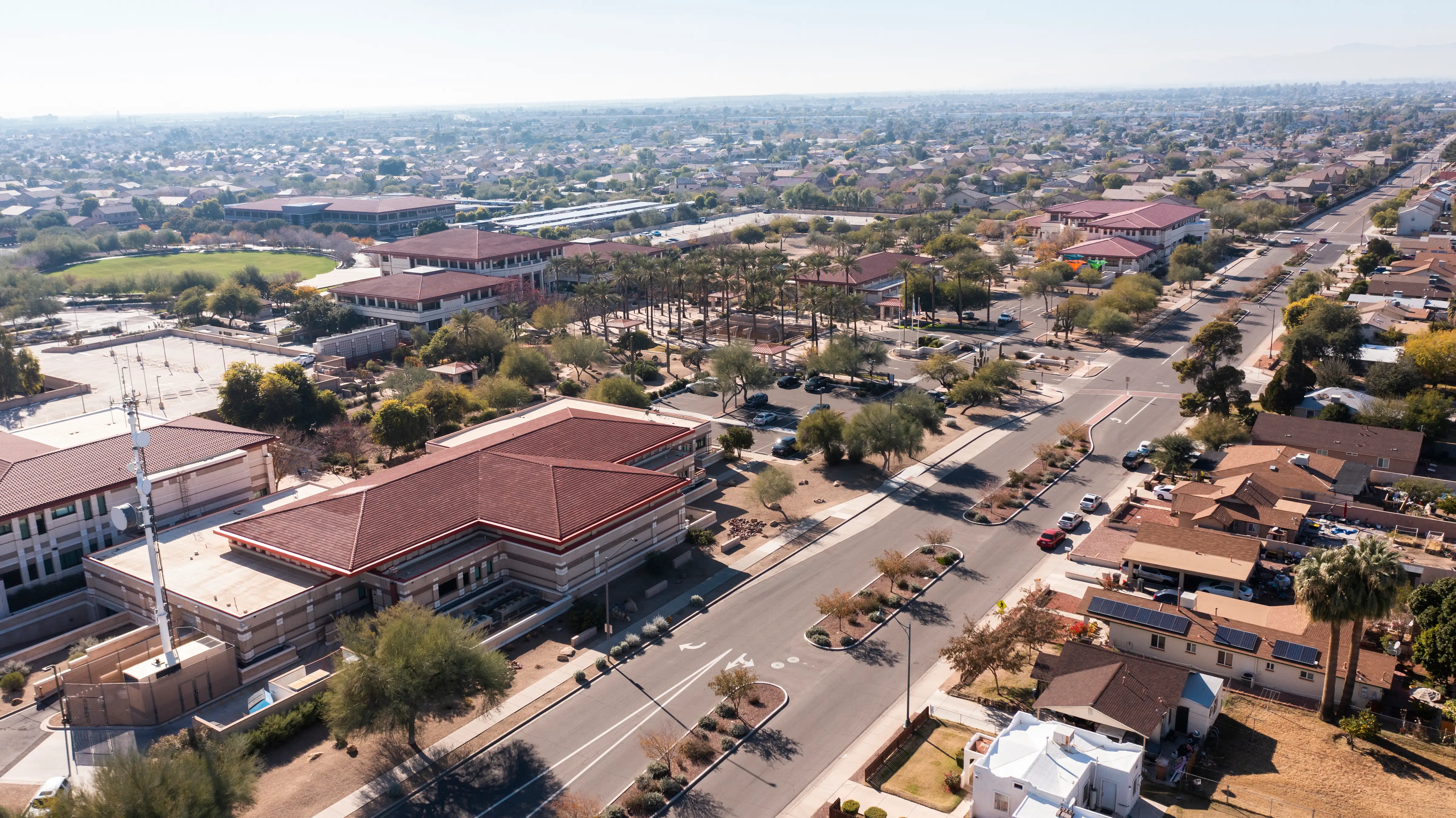 Afternoon aerial view of the downtown skyline and surrounding housing of Peoria, Arizona.