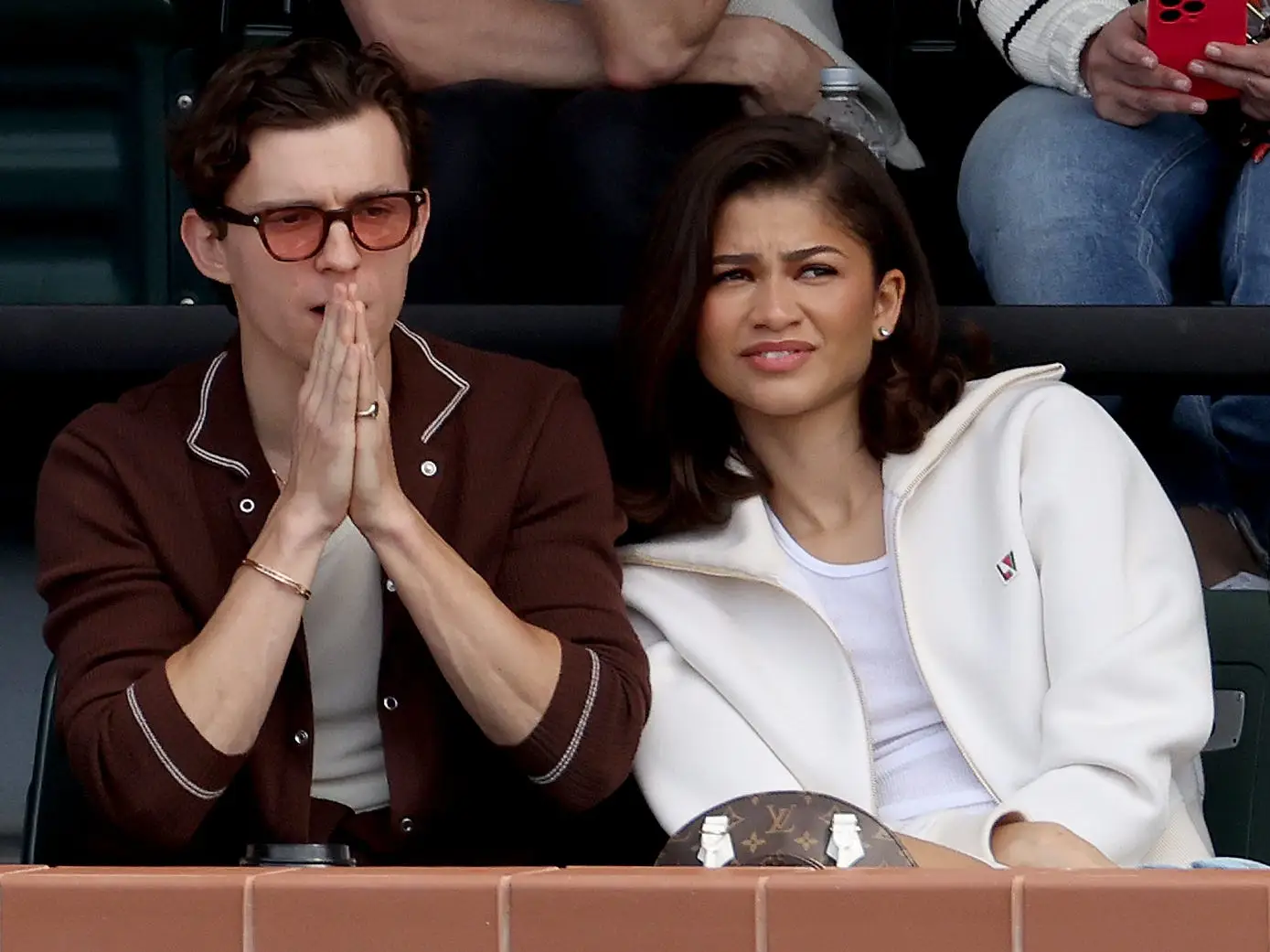 Tom Holland and Zendaya watch Carlos Alcaraz of Spain play Daniil Medvedev of Russia during the Men's Final of the BNP Paribas Open at Indian Wells Tennis Garden on March 17, 2024 in Indian Wells, California.