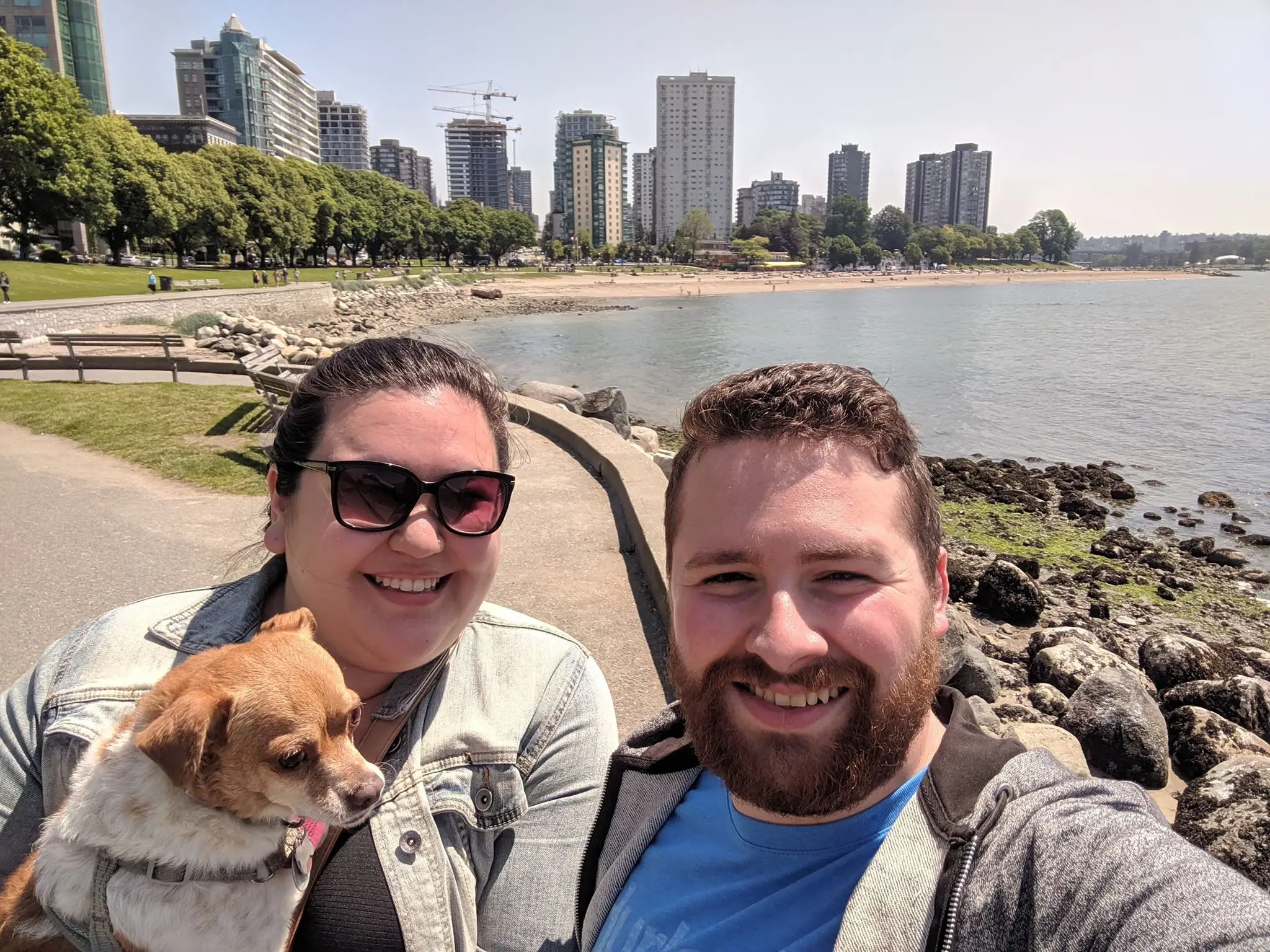 the author and her husband on the Vancouver Seawall with their dog, Ellie