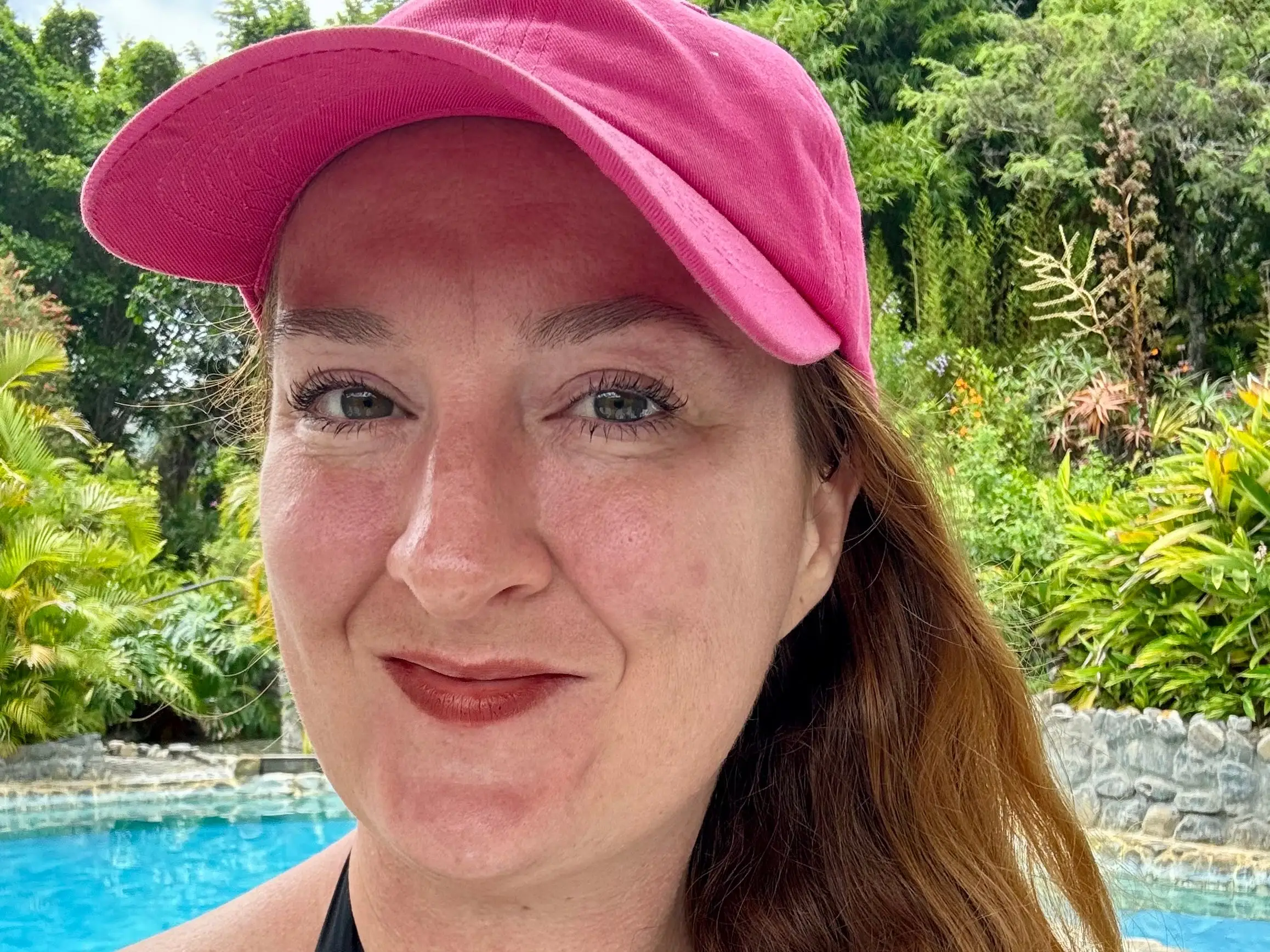 A woman wearing a pink hat in Ecuador.