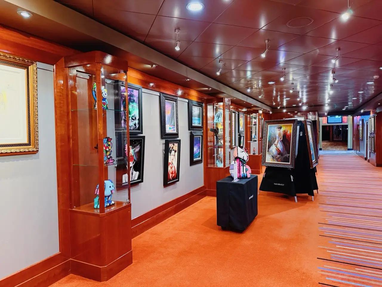 Painting and sculptures in on board NCL art gallery on cruise ship