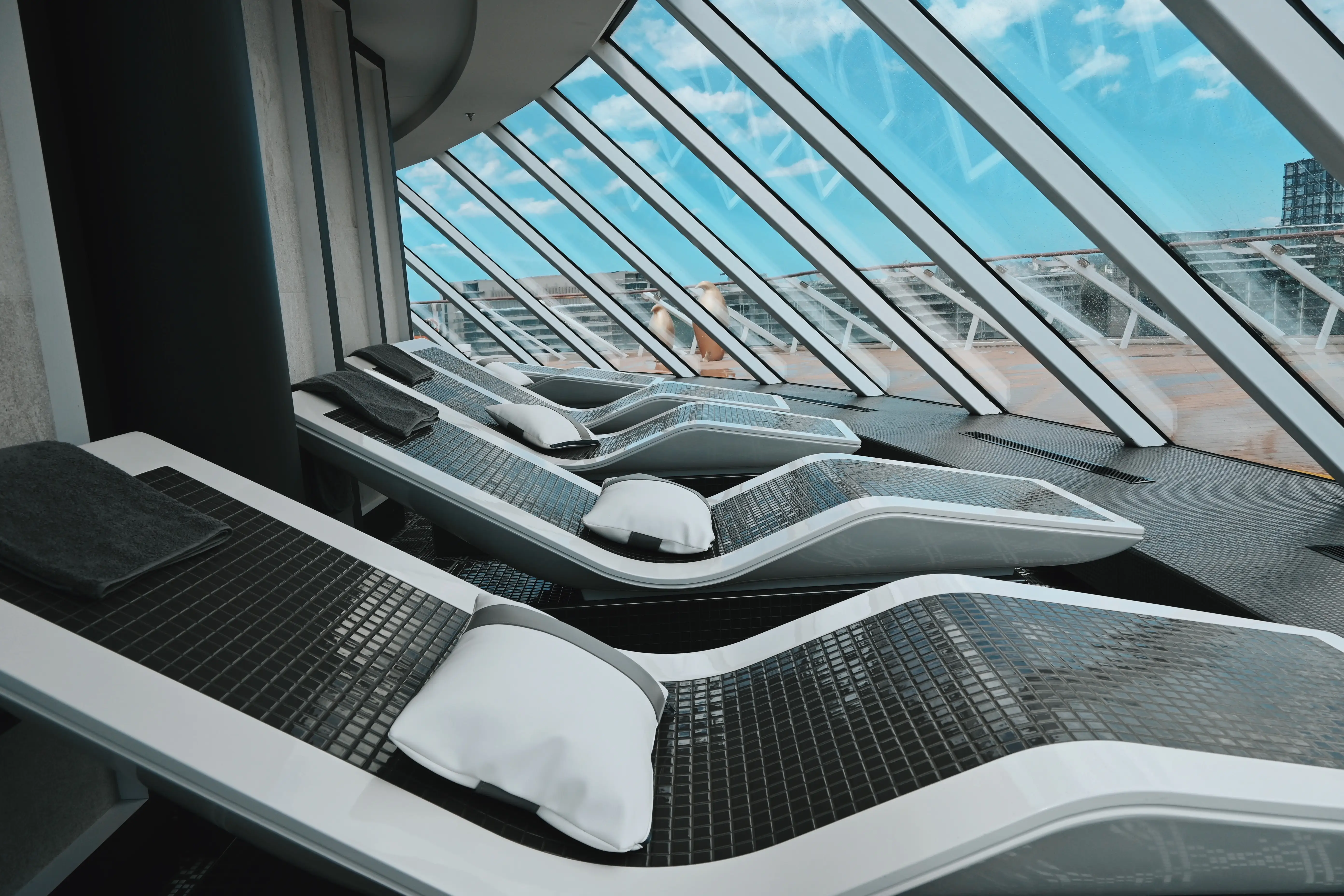 View of angled beds below window in Thermal Spa on Celebrity Edge