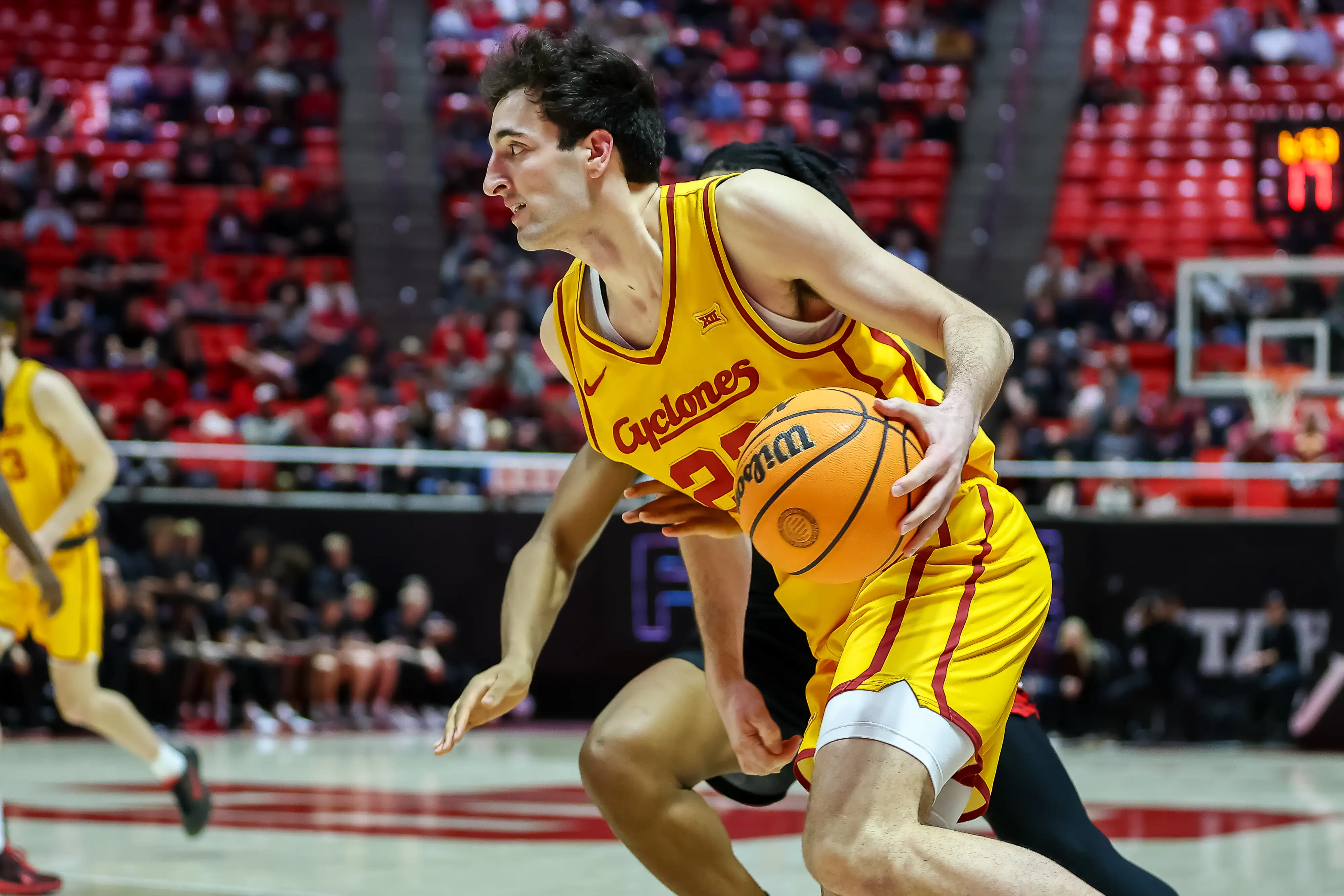 Milan Momcilovic #22 of the Iowa State Cyclones drives to the basket during the second half of the game between Iowa State Cyclones and Utah Utes.