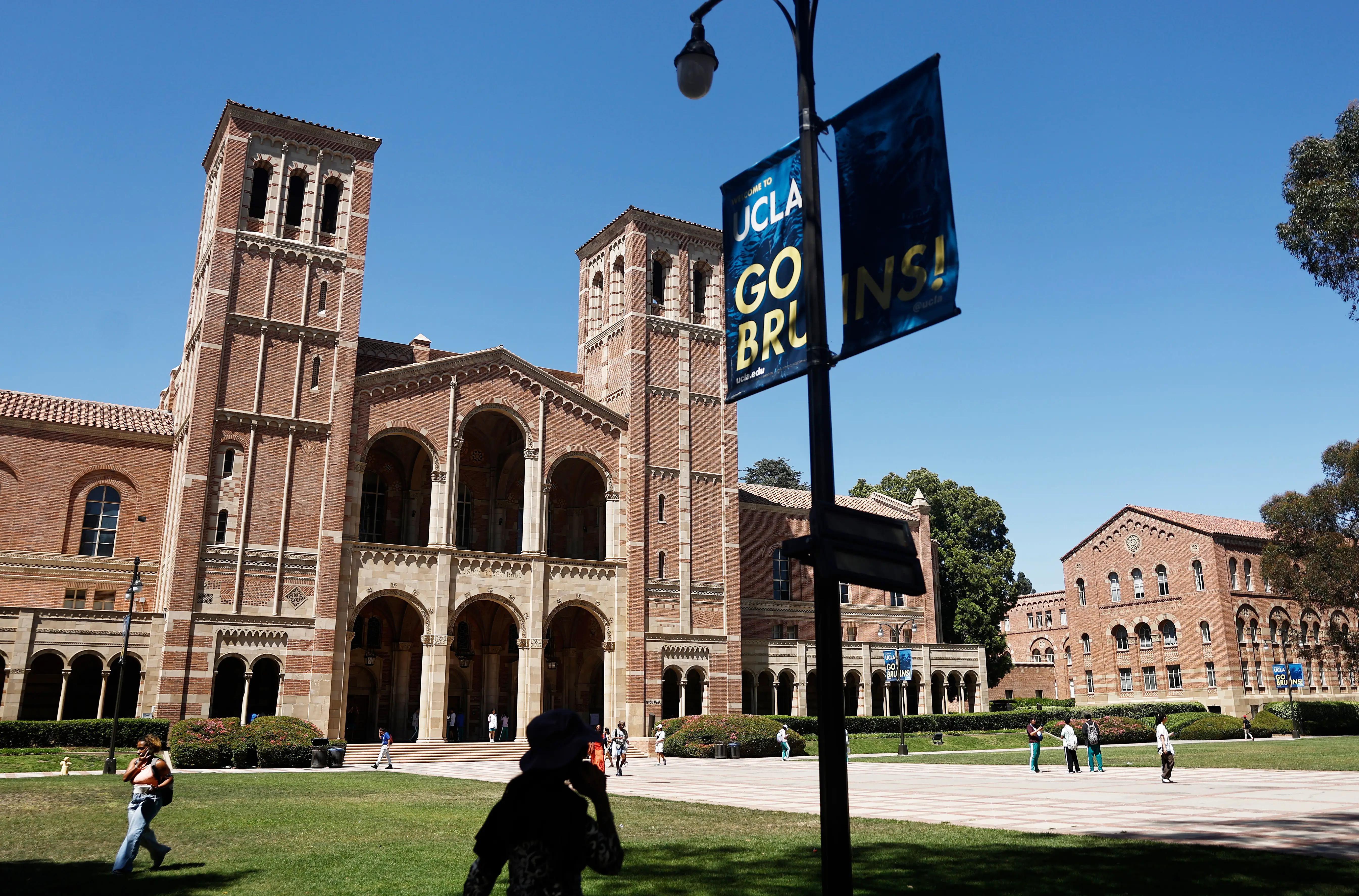 People walk on the plaza outside Royce Hall on the UCLA campus on July 30, 2025 in Los Angeles, California.