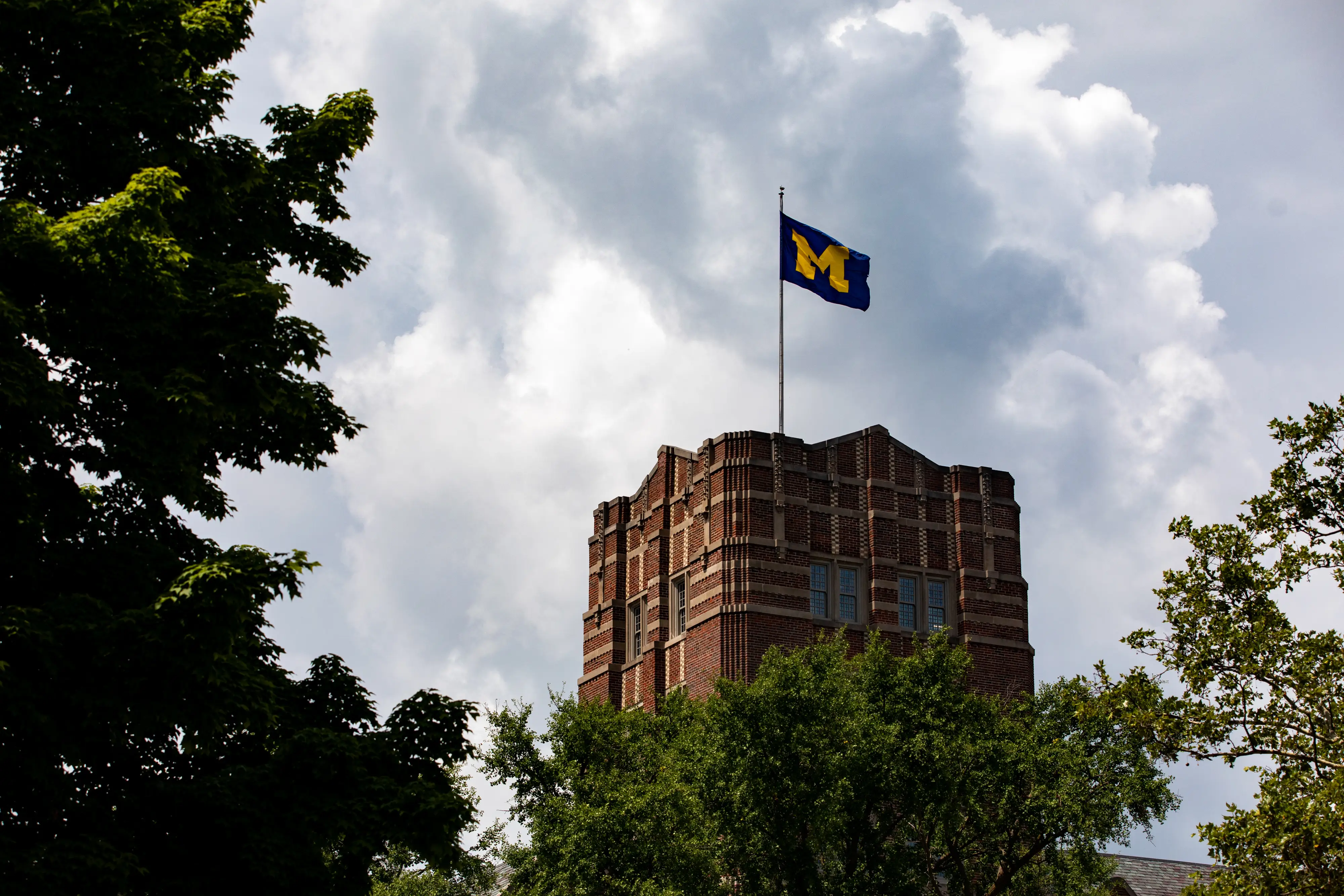 A University of Michigan flag on the Michigan Union building at the schools campus in Ann Arbor, Michigan, US, on Monday, July 28, 2025.