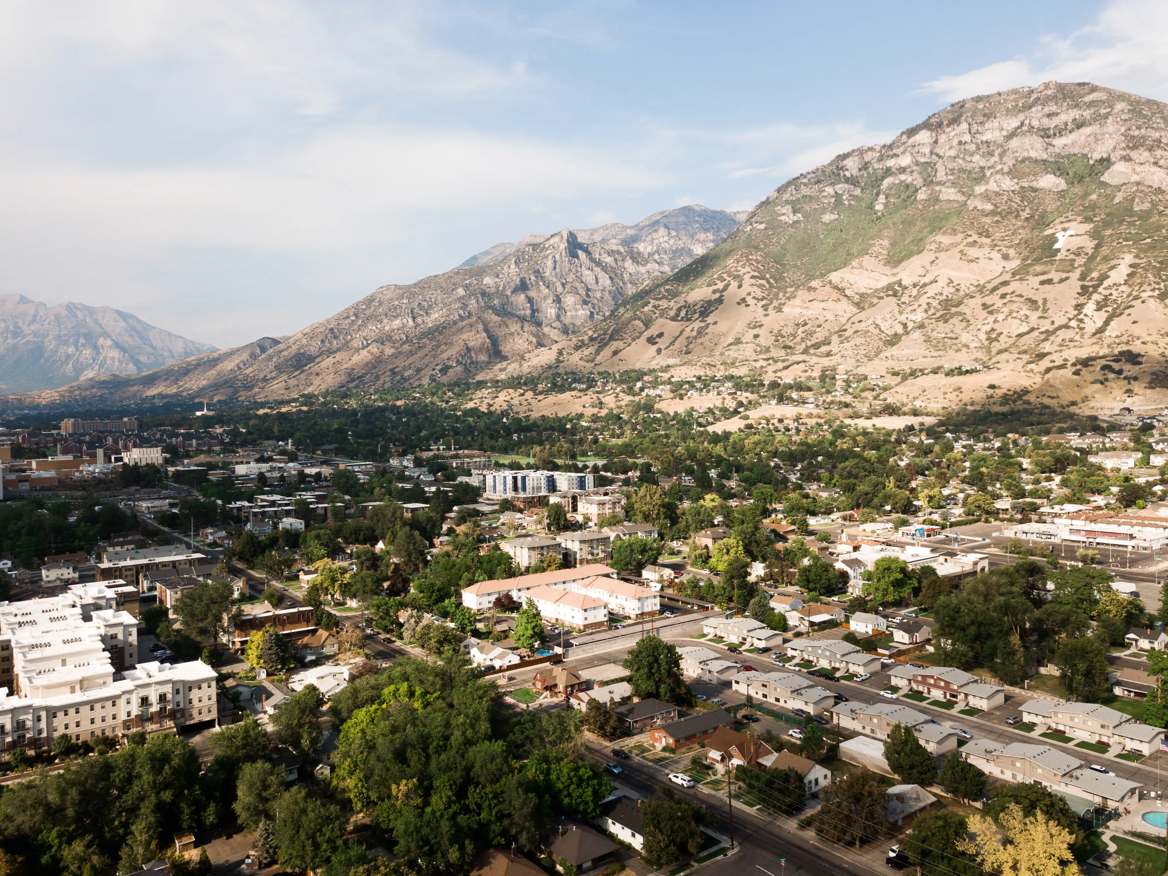 Aerial view of Provo City, Utah, Y Mountain, Brigham Young University, and surrounded neighborhoods