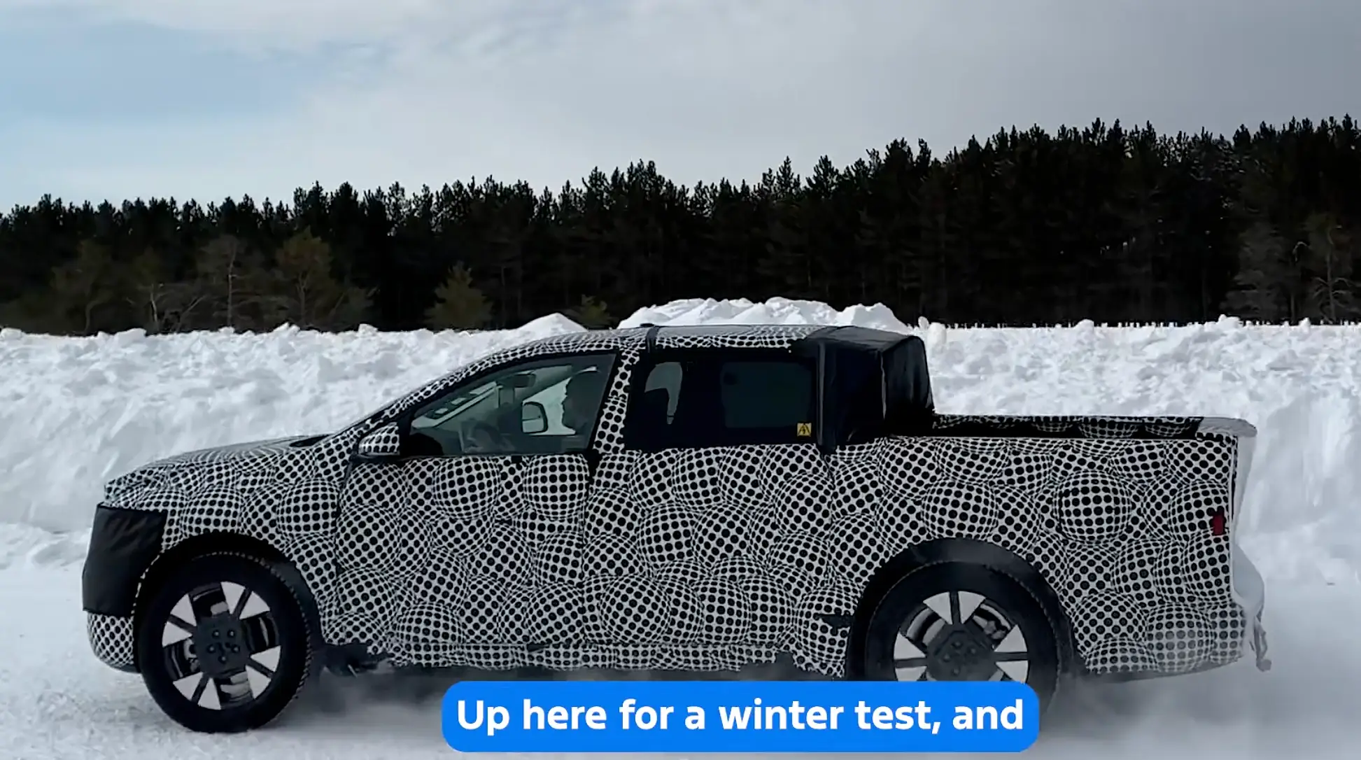 A Ford Fathom is doing winter testing in a camouflage wrap.