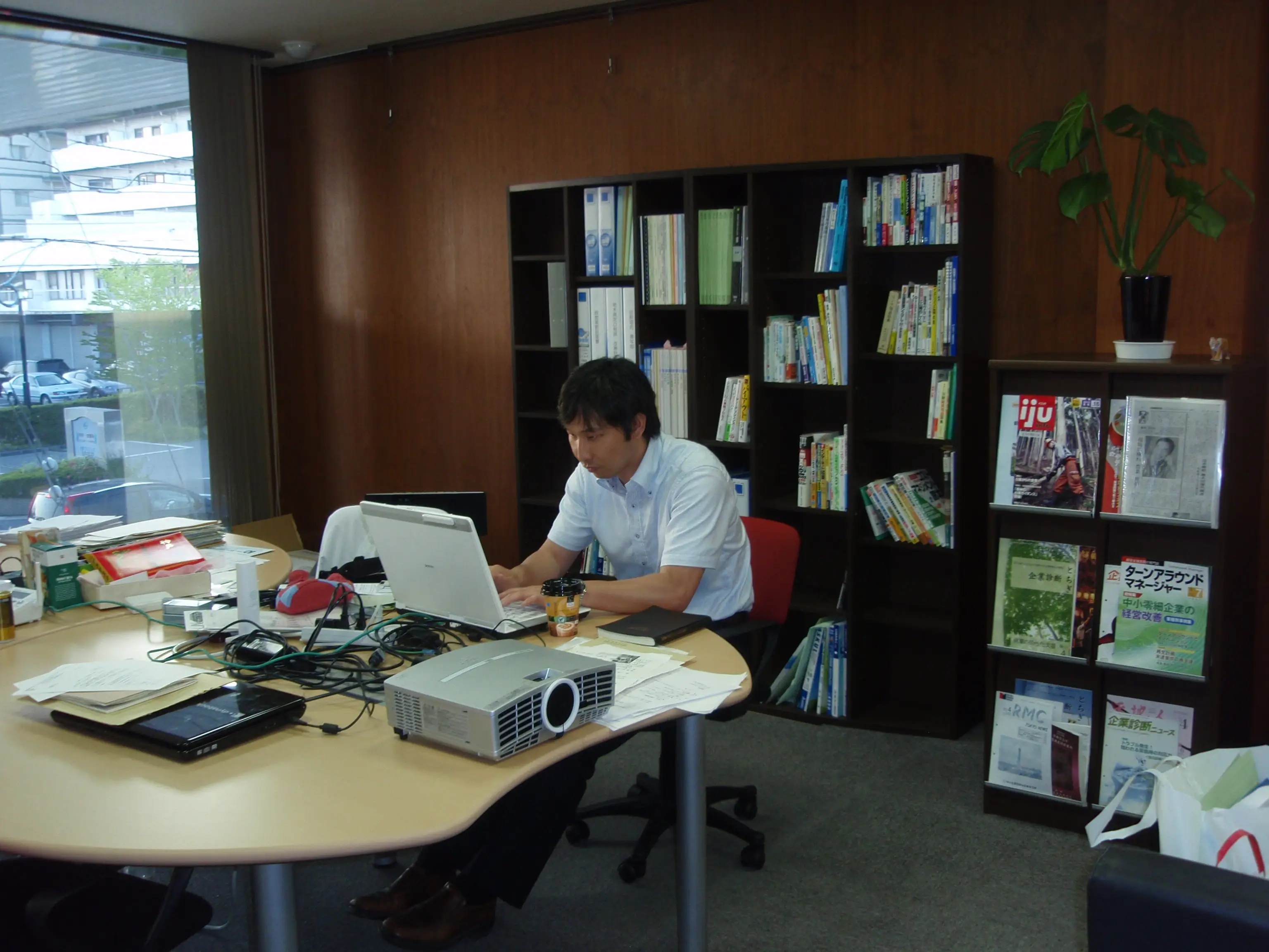 Daisuke Fujii at his desk working in Japan.