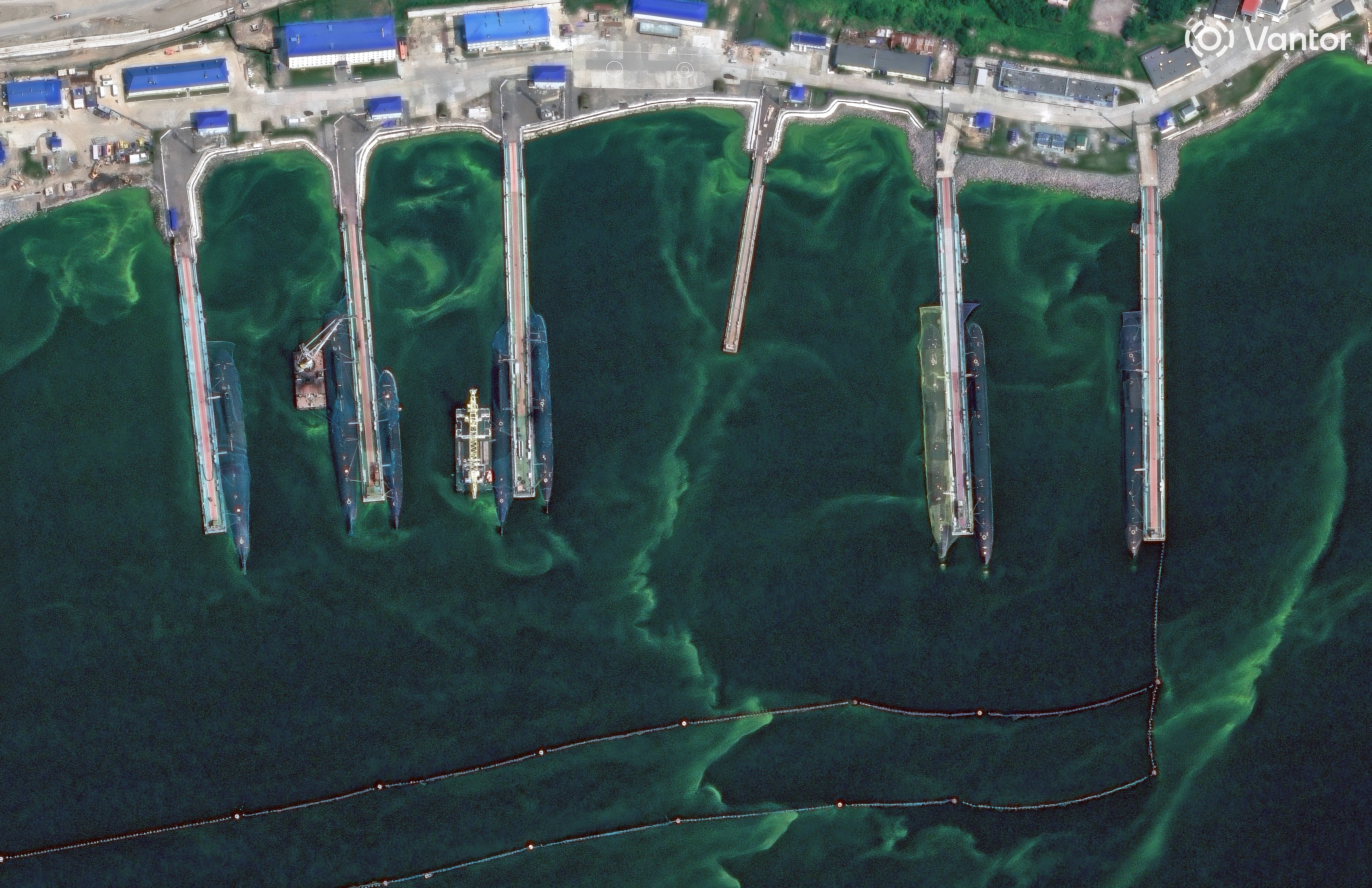 An overview of anti-drone netting over submarines at Rybachiy in August.