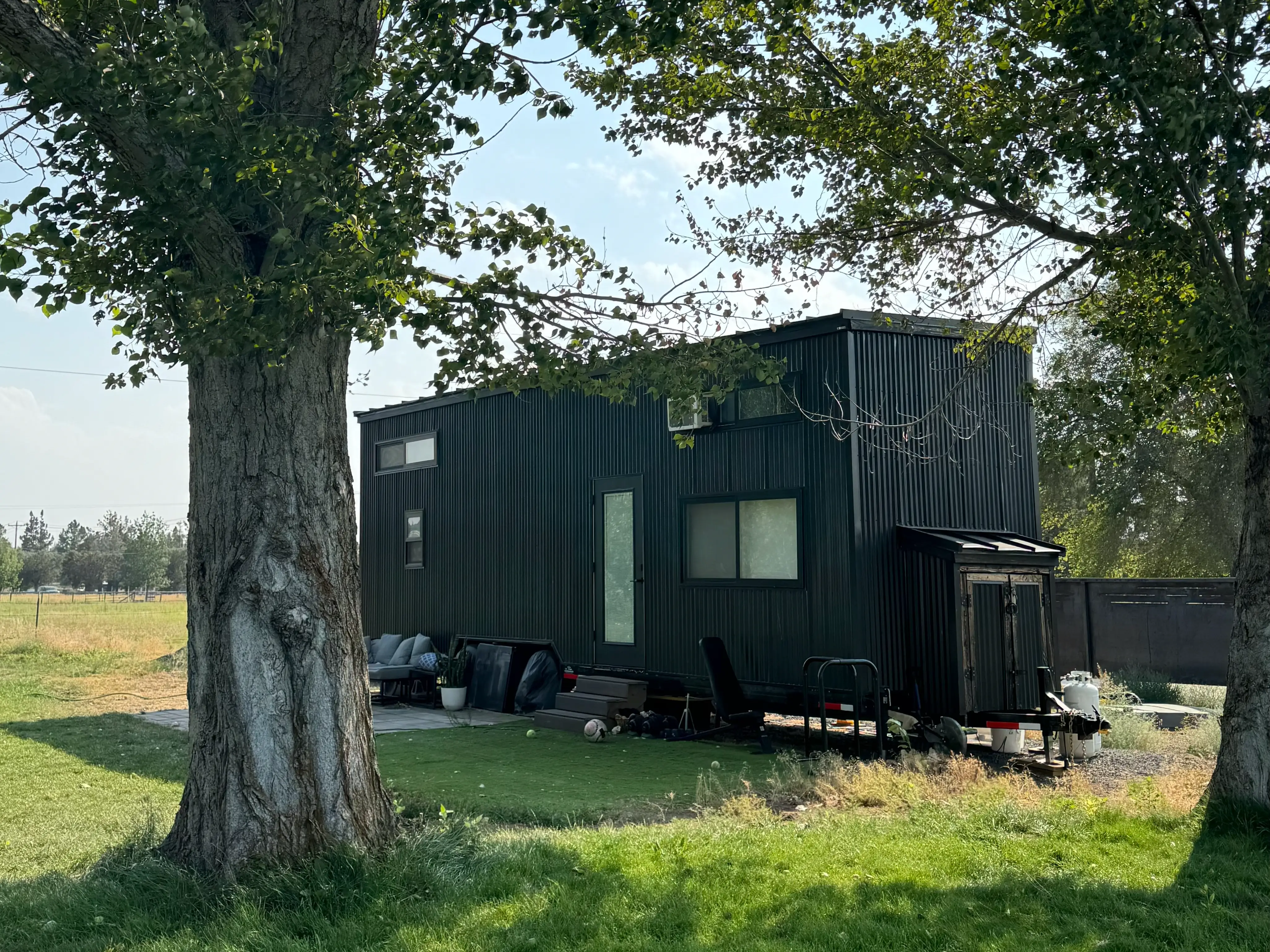 Tiny home on wheels near trees