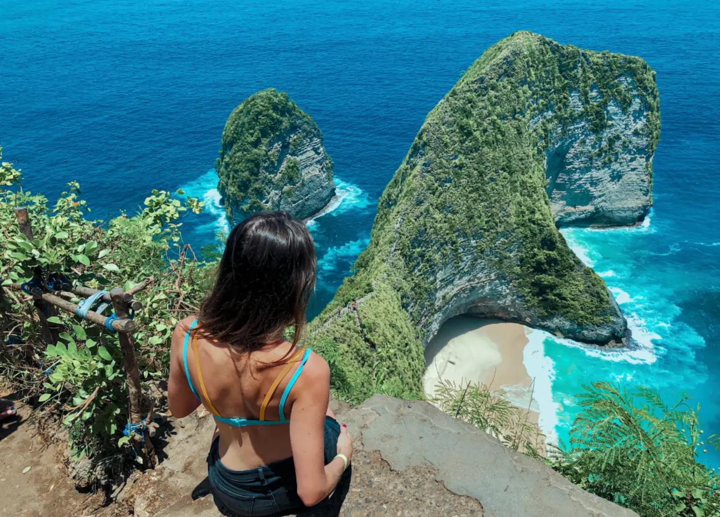 The writer gazing out at turquoise-and-blue water in Nusa Penida.