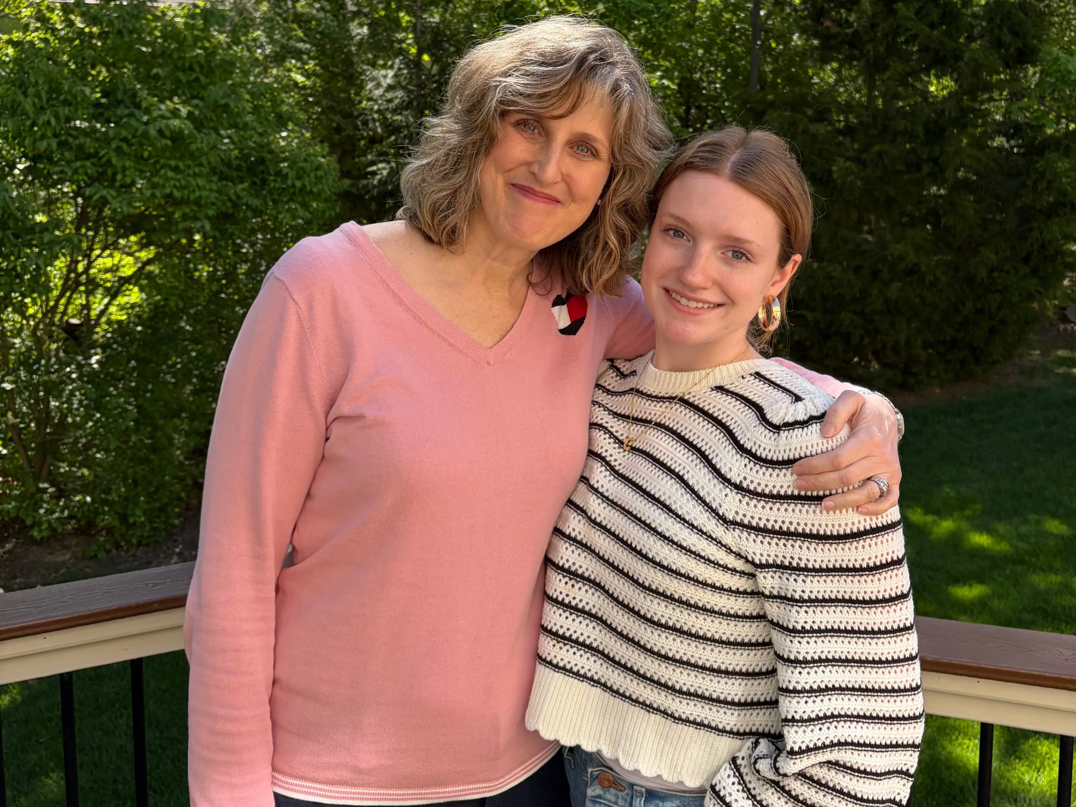 Mom and daughter posing for photo