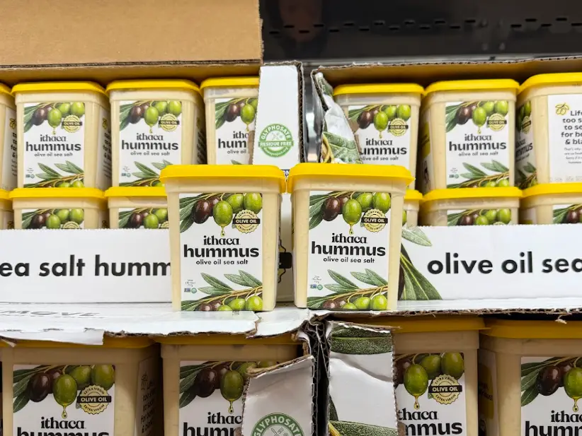 Stacks of Ithaca olive-oil and sea-salt hummus at Costco.