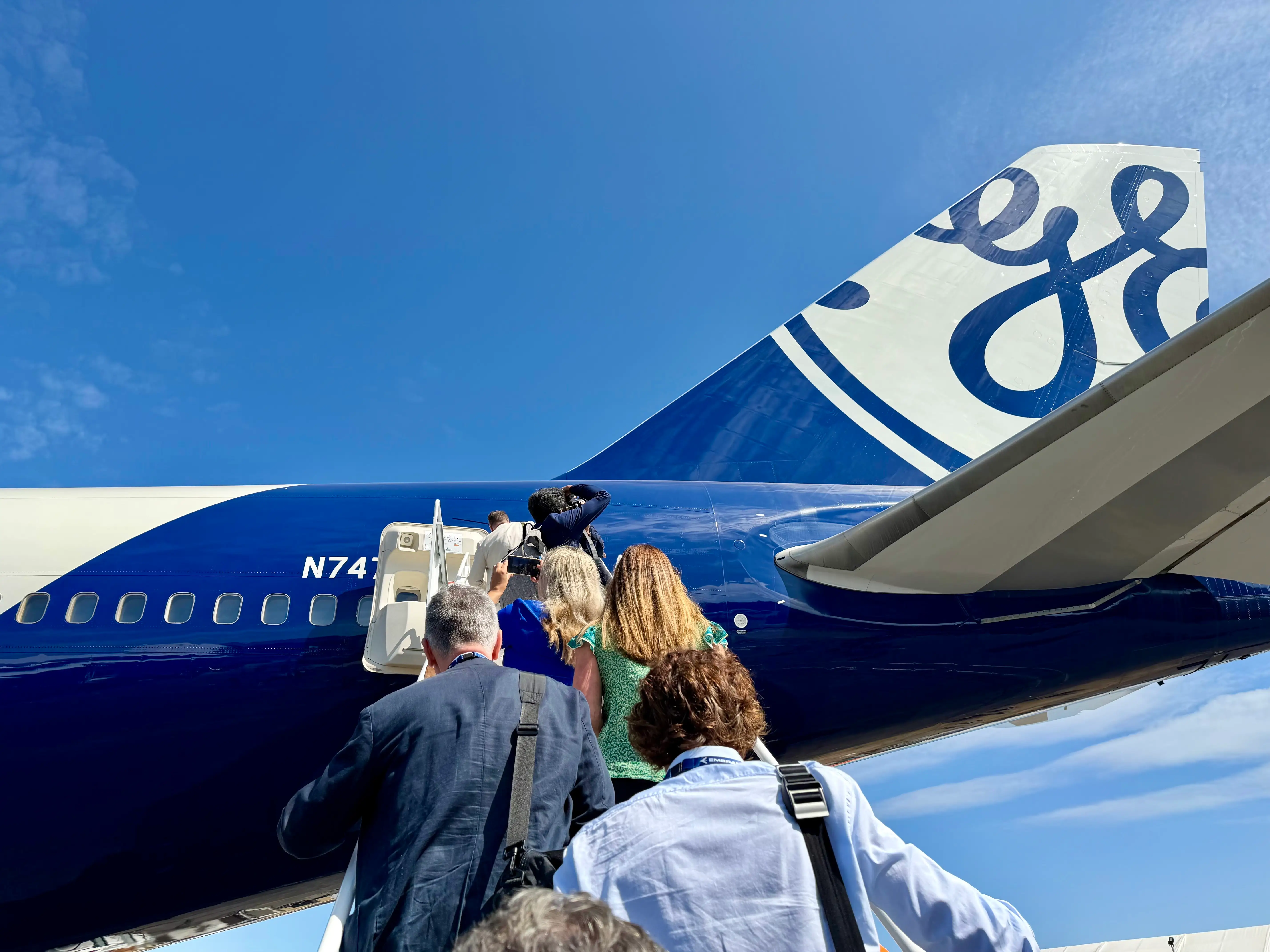Boarding the GE 747 testbed, looking up at its blue and white tail.