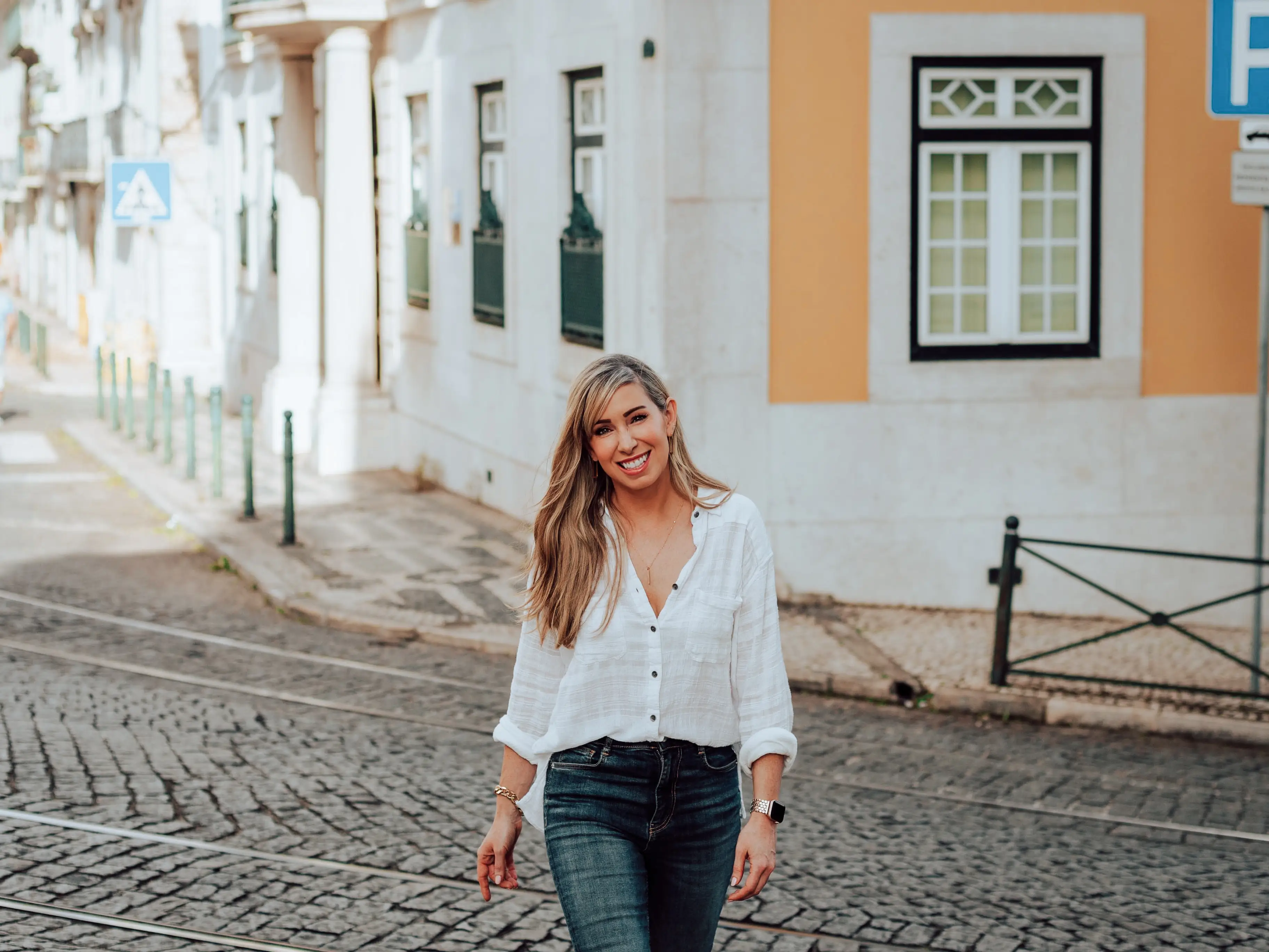 Woman smiling in cobblestone road