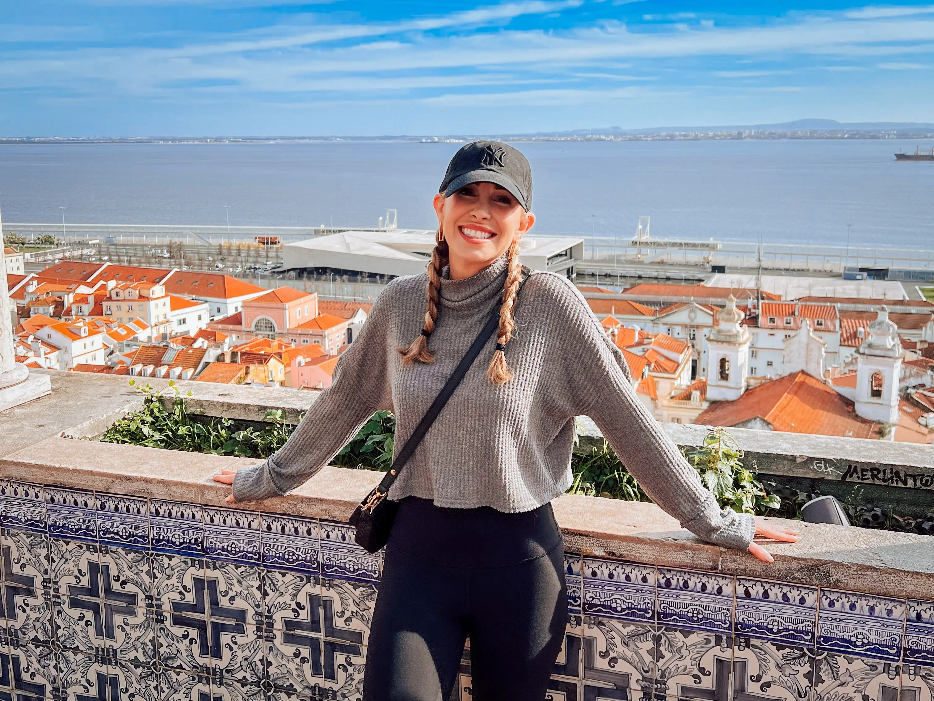 Woman smiling in front of balcony