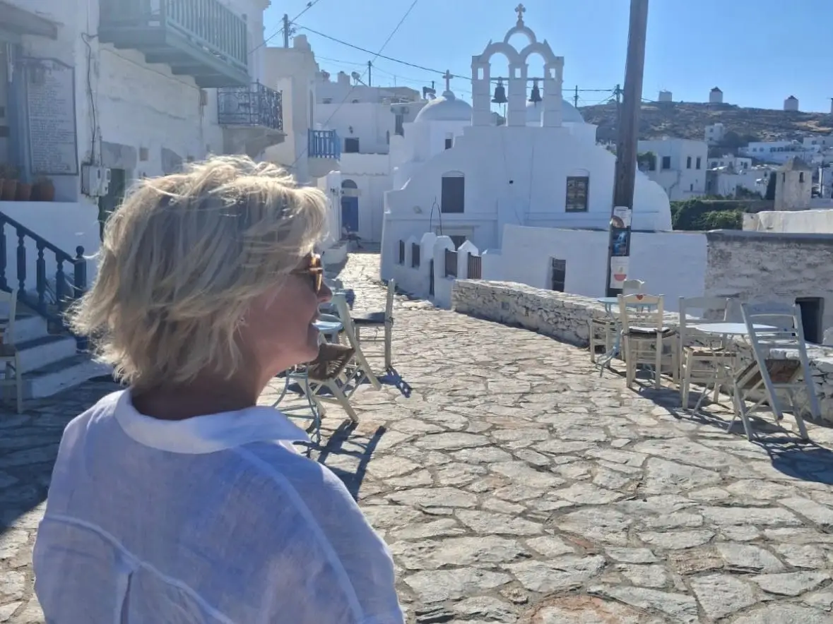 A woman walking in Greece.