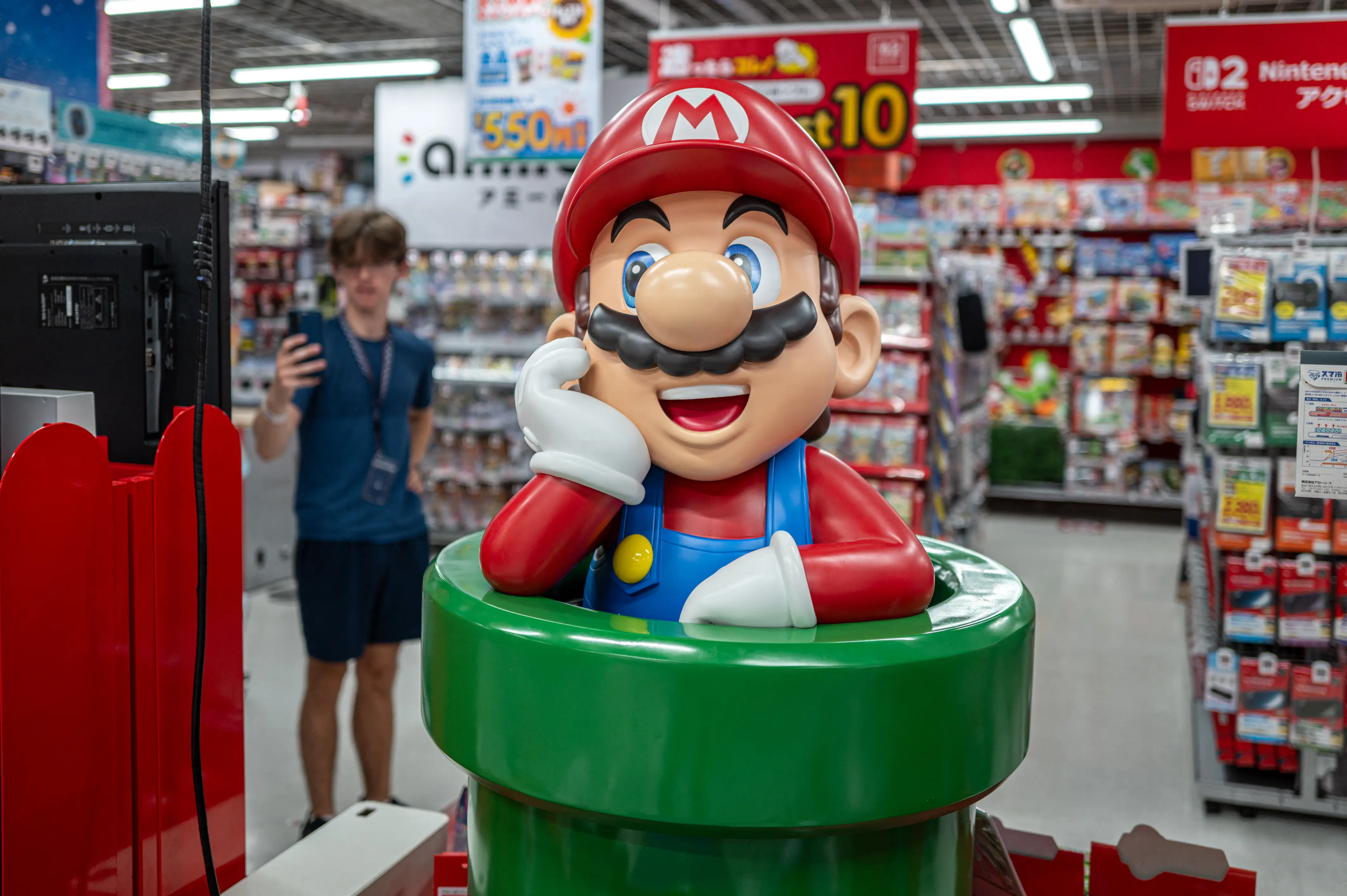 A customer visits the gaming section for Nintendo products at a shop in Tokyo on August 6, 2026.