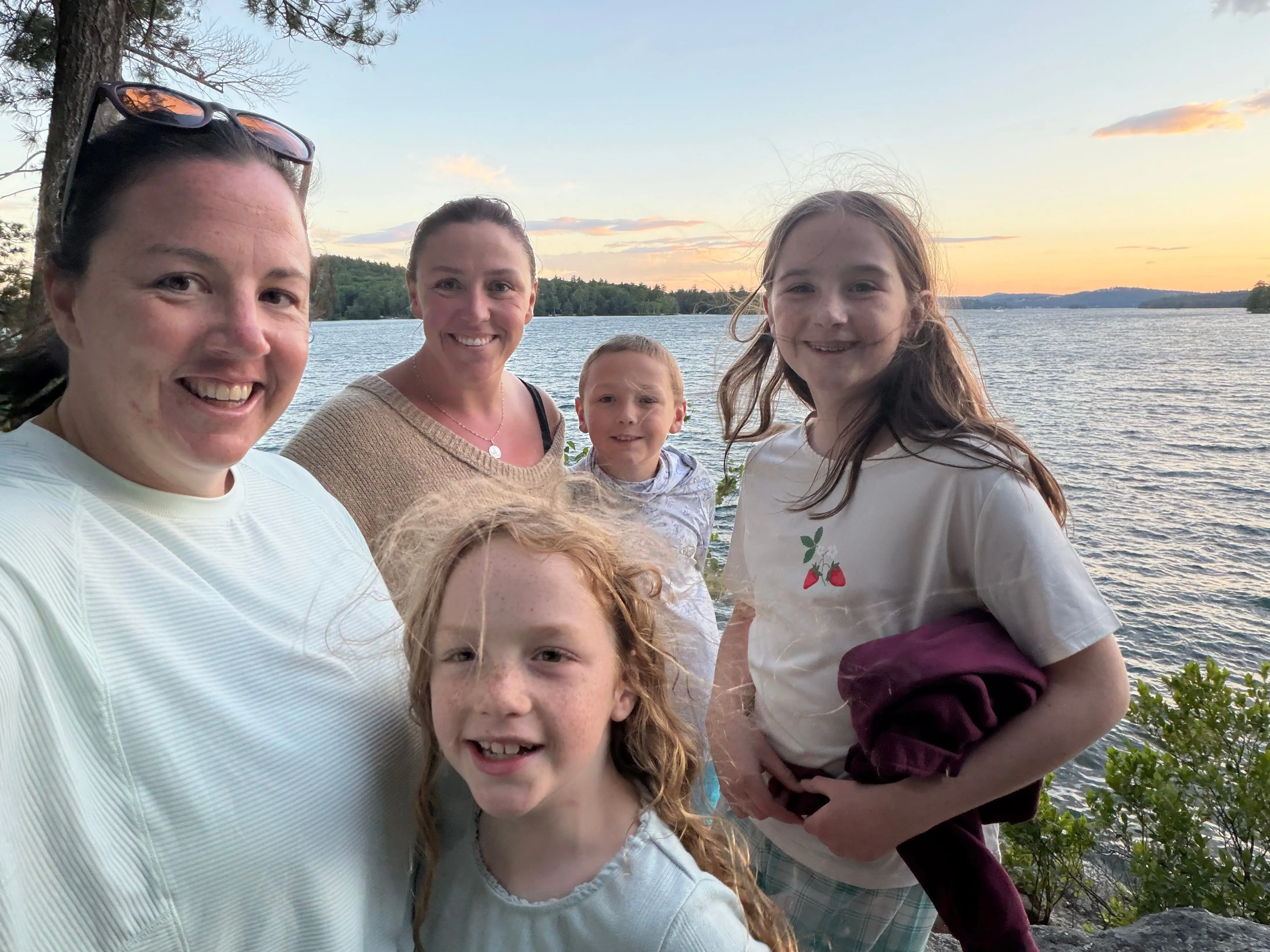 The author (left) with family members at a lake in New Hampshire.
