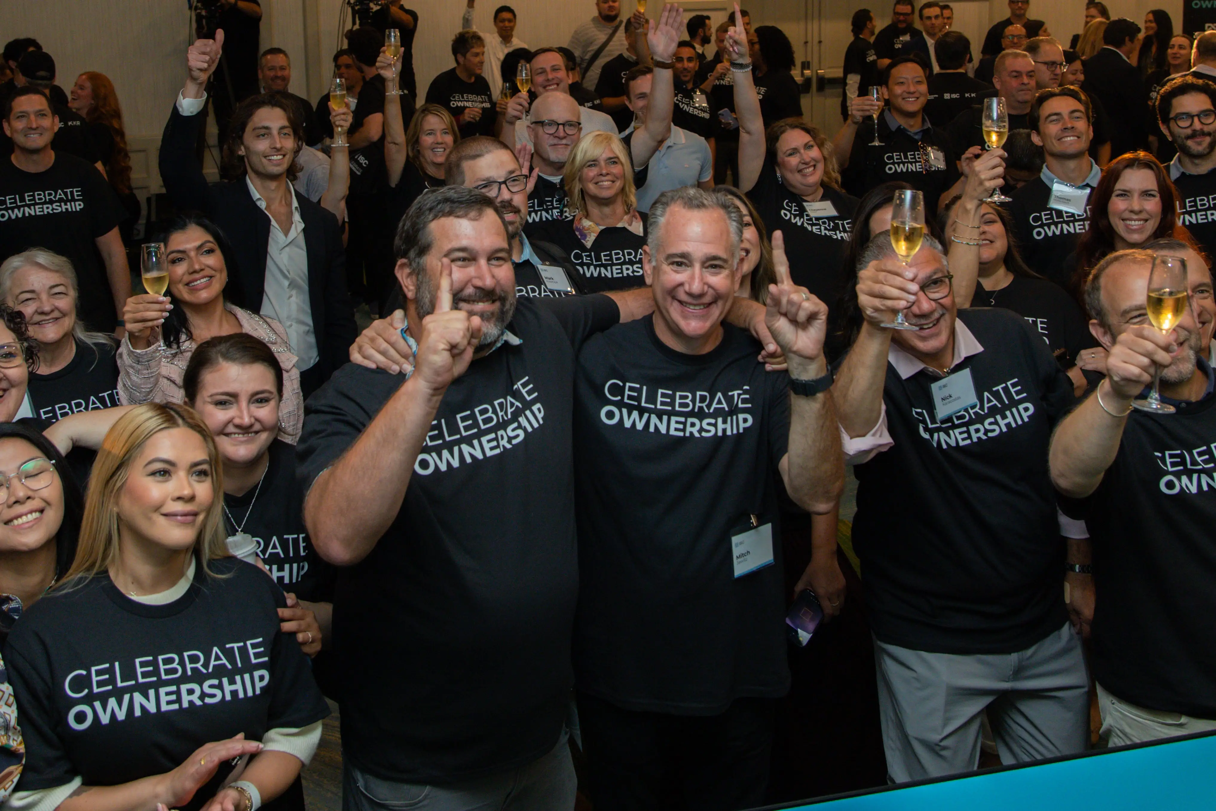 ISC employees celebrate their payouts.