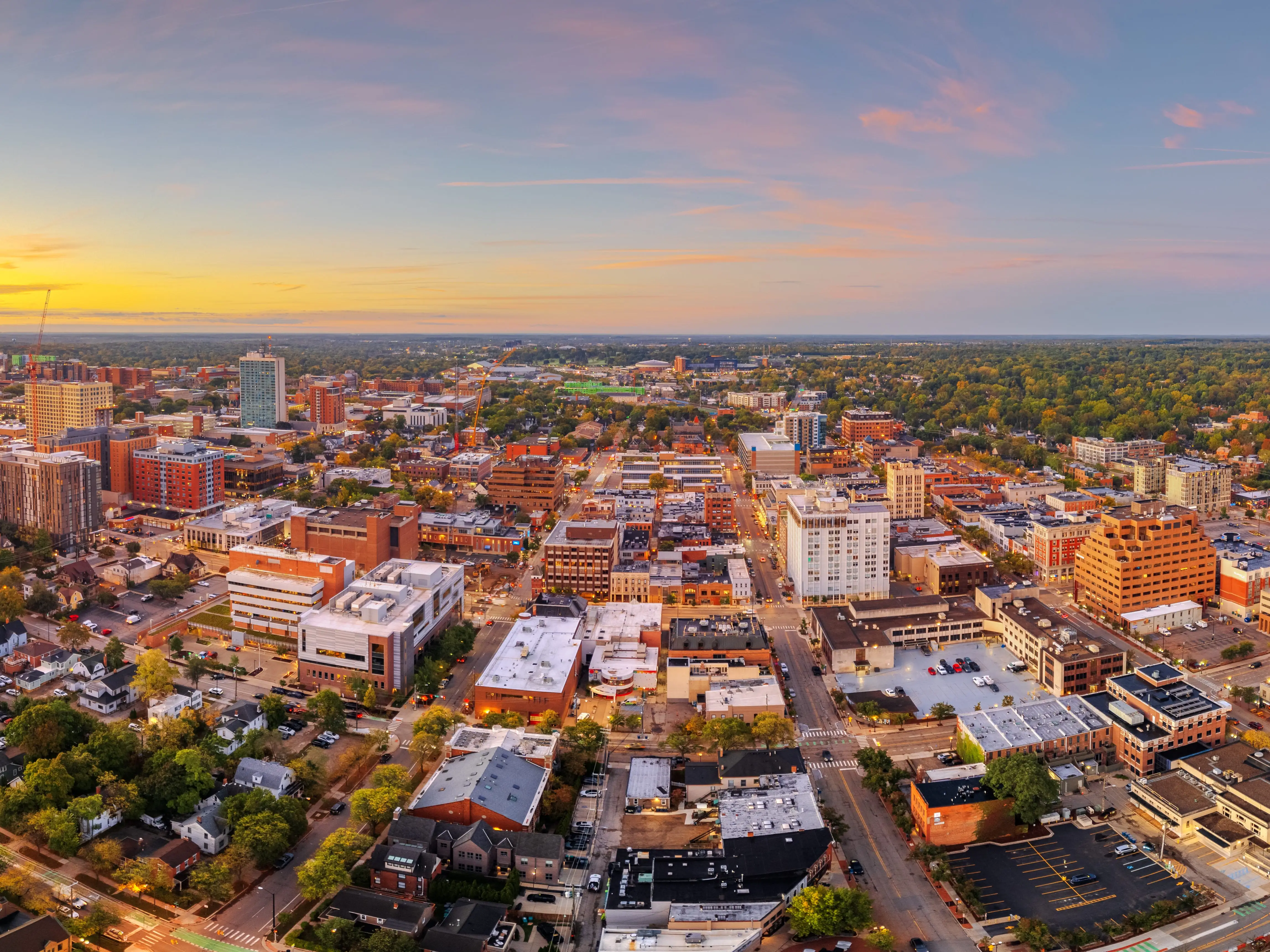 Ann Arbor, Michigan, USA college town skyline at dusk.