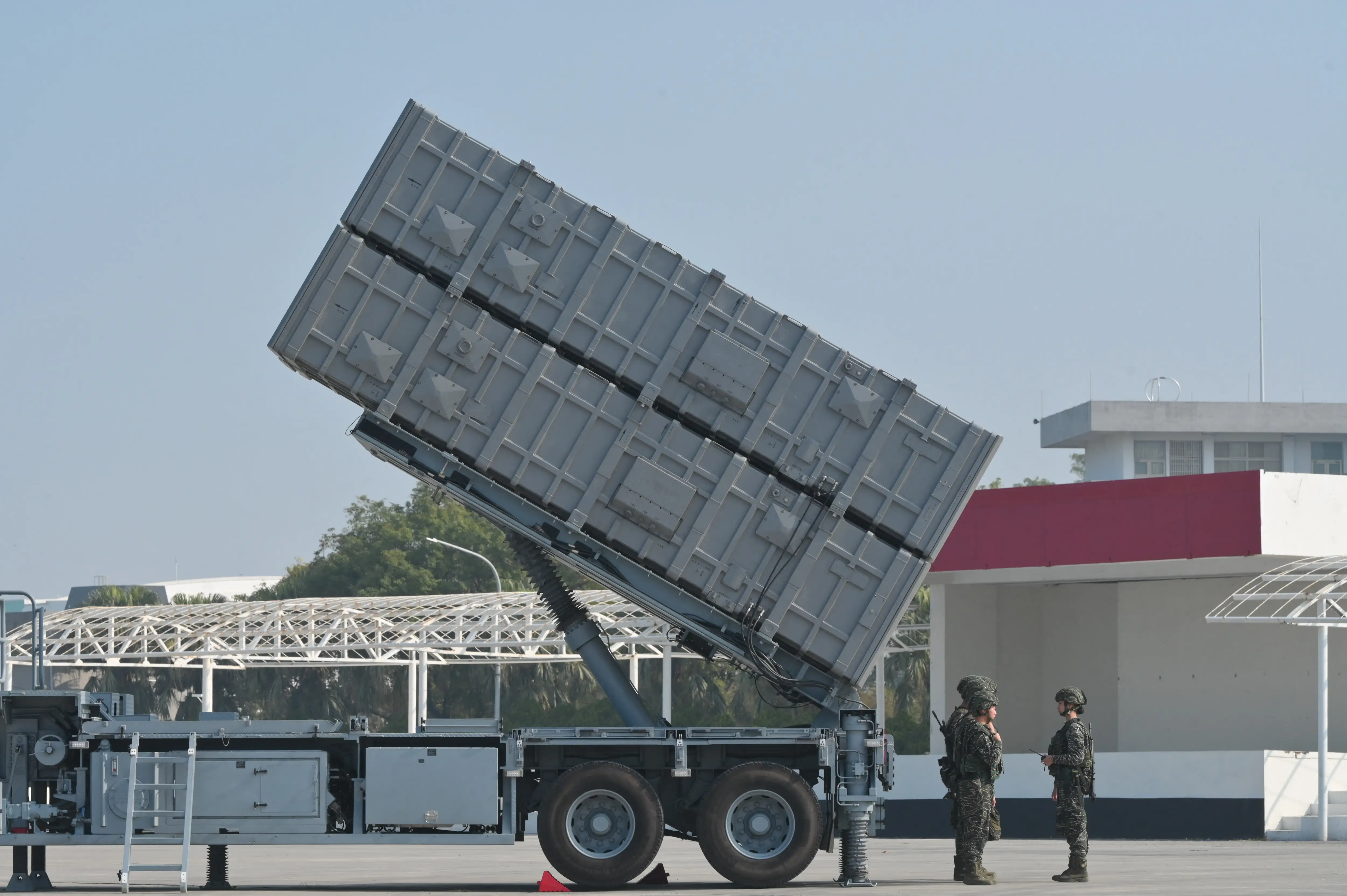 A Hsiung Feng III launcher container is raised for firing.