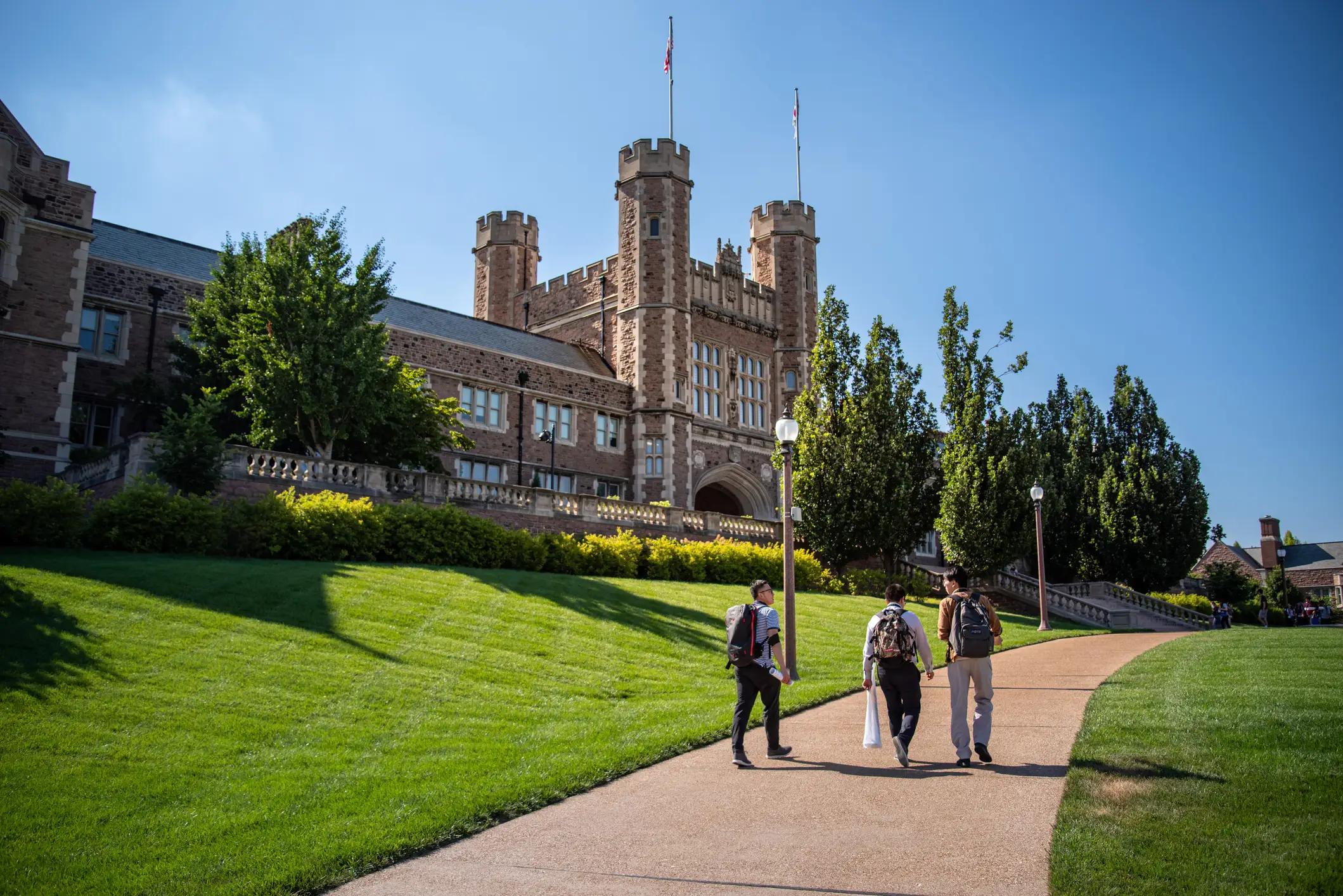 Students walking in front of Brookings Hall at Washington University in St. Louis.