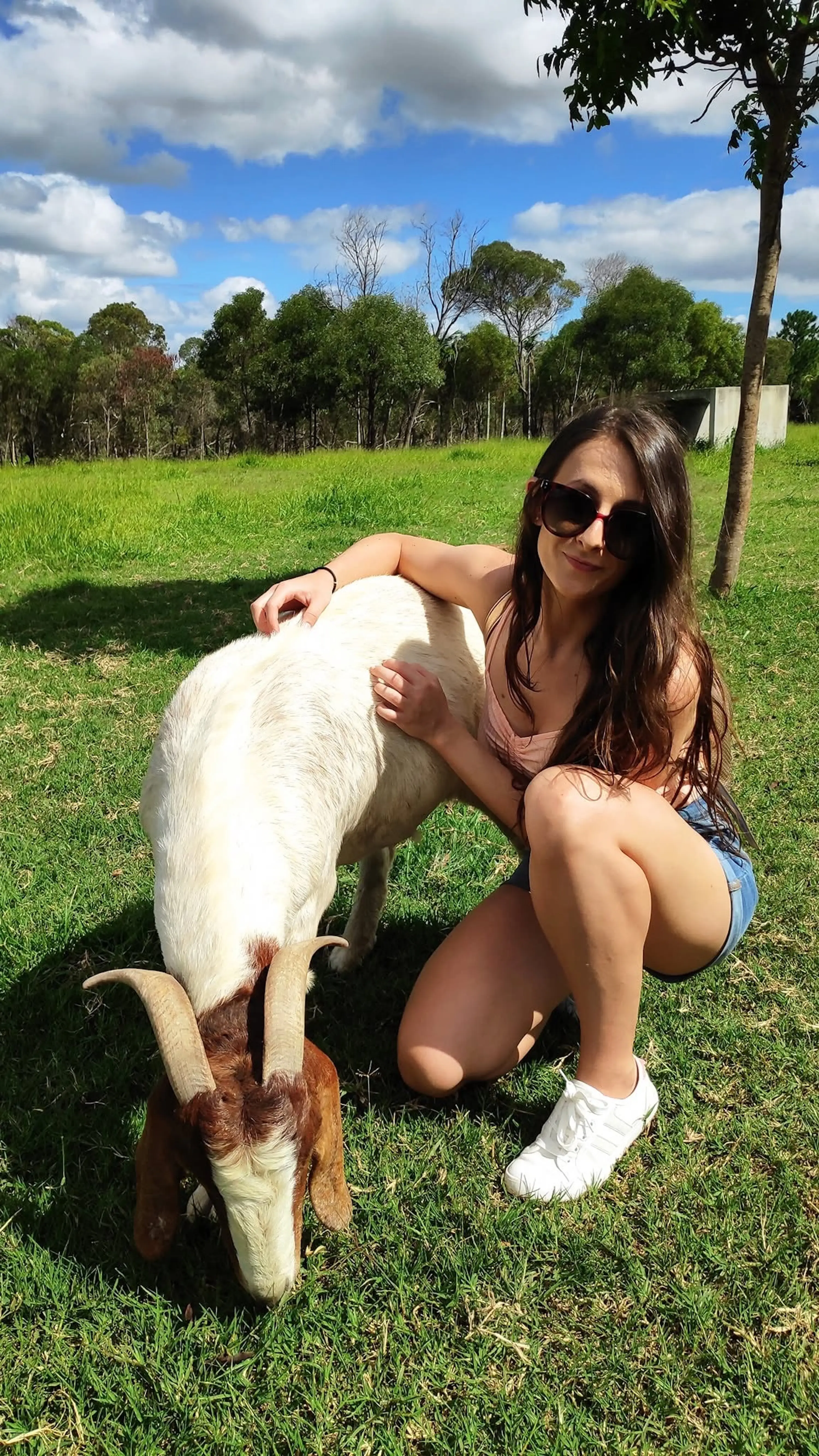 The author poses with a goat.