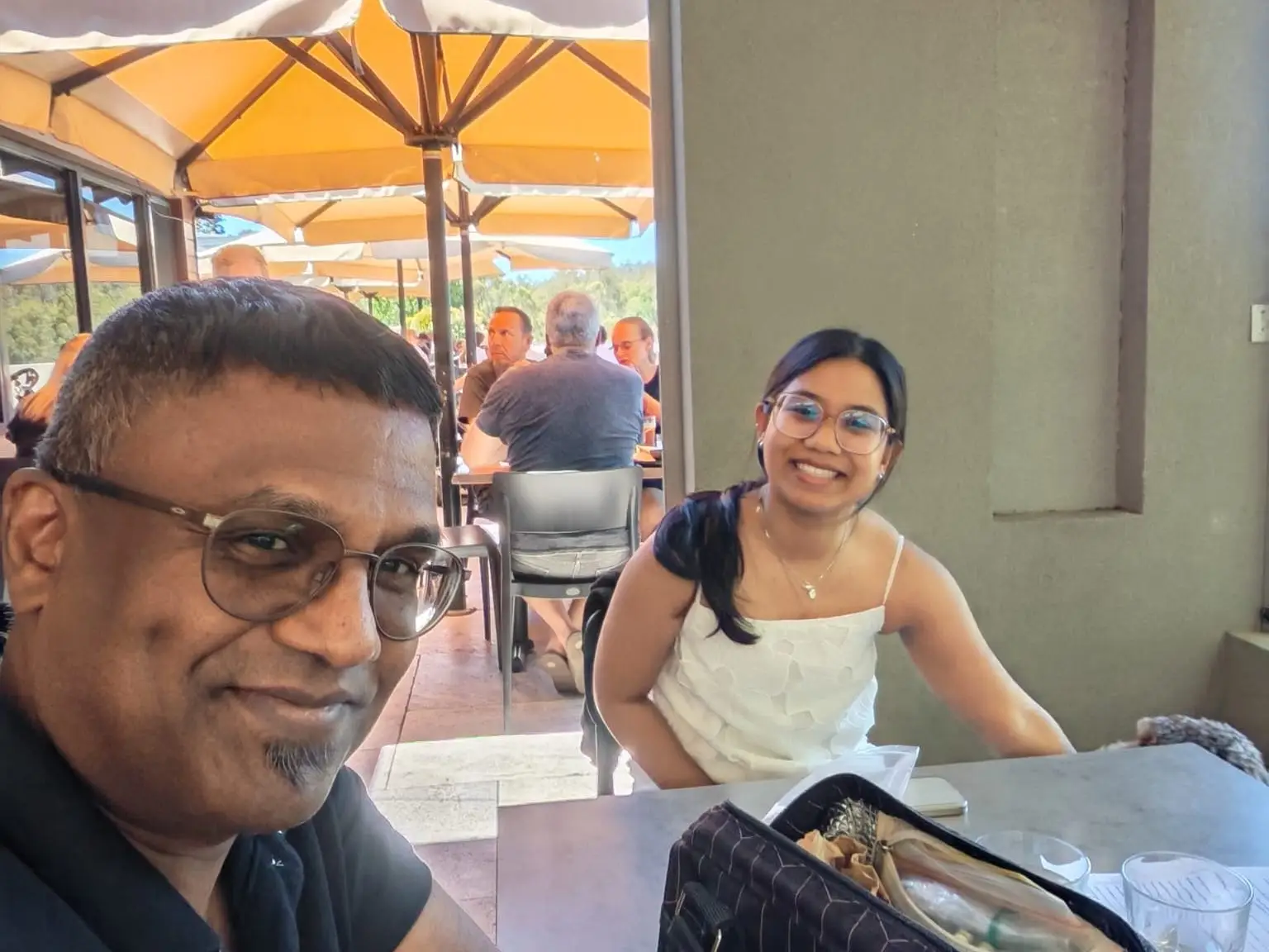 The writer sitting at a table with her dad.