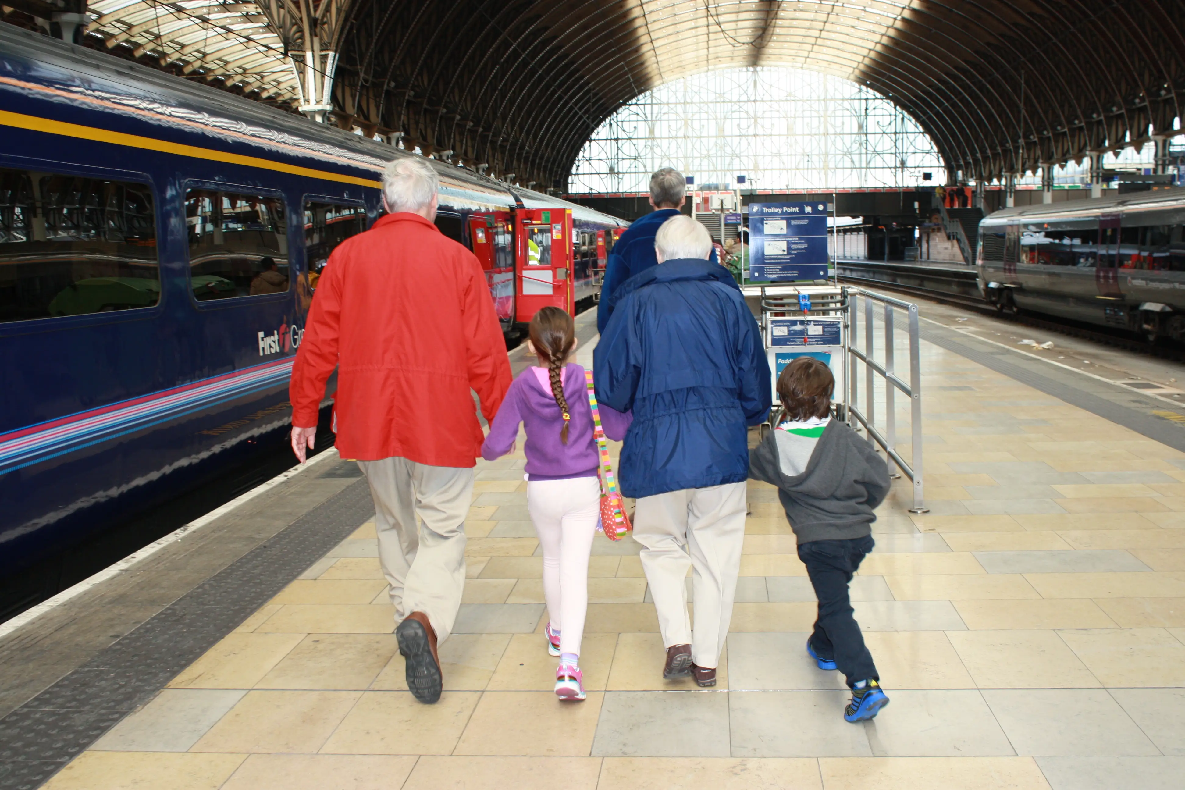 Grandparents and kids at train station