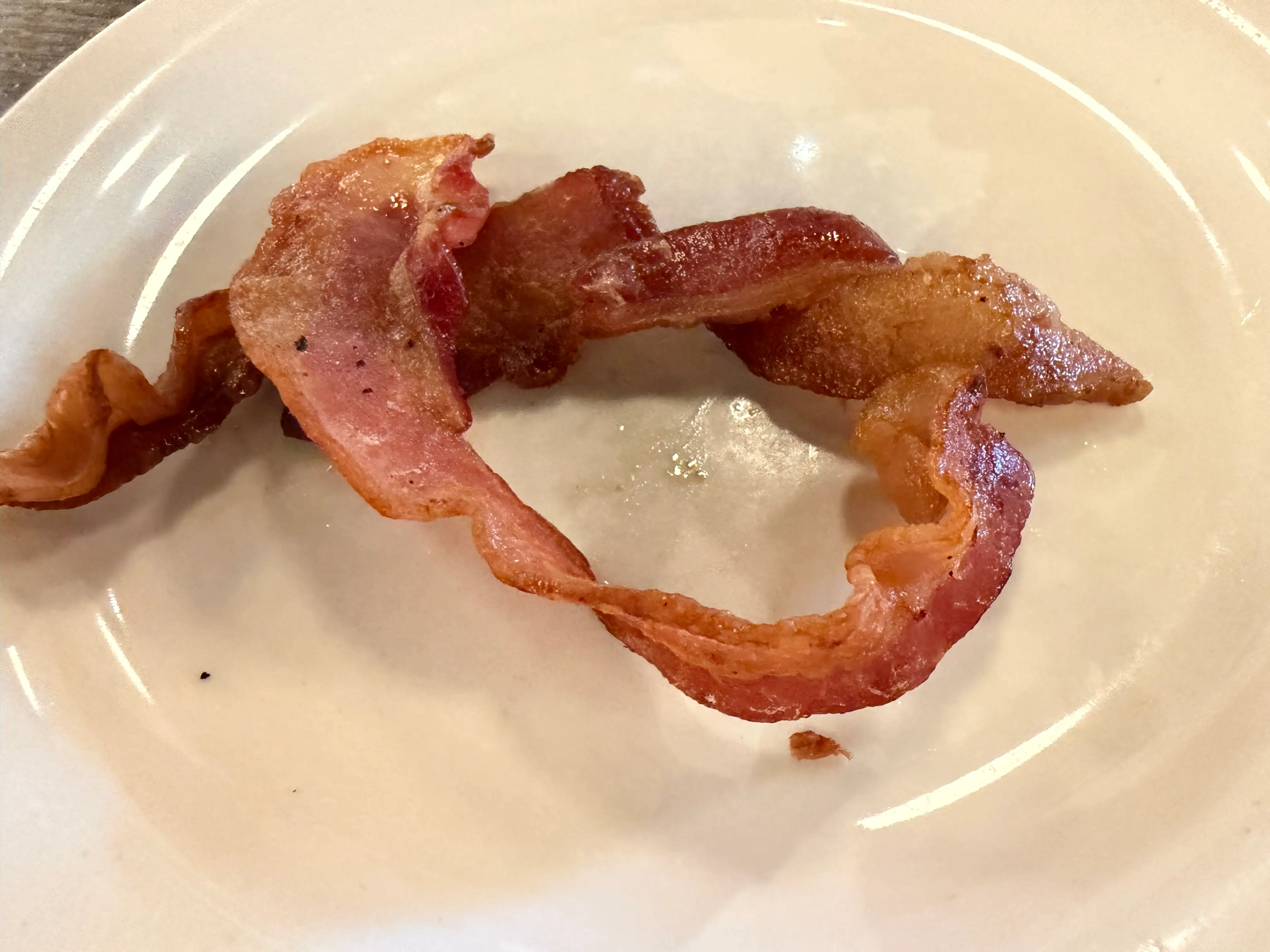 Two piece of bacon on plate