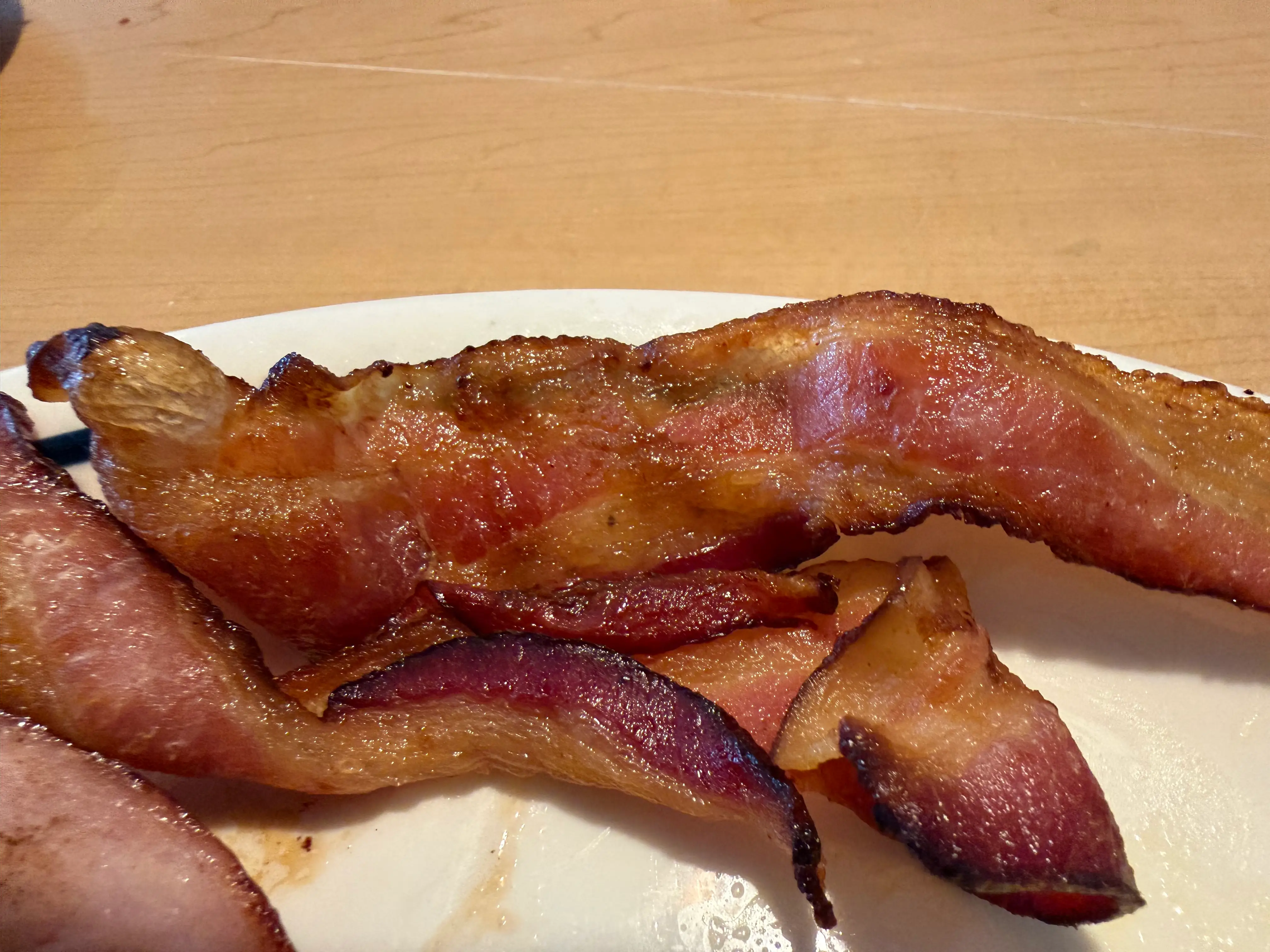 Two slices of bacon on plate at IHOP