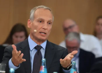 Booking’s CEO says AI will have a ‘human cost’ — and he wants every employee to be ‘AI literate’ in case their job goes away