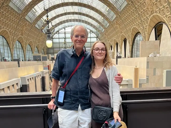 The writer and her father stand together on a balcony overlooking the Musée d'Orsay in Paris.