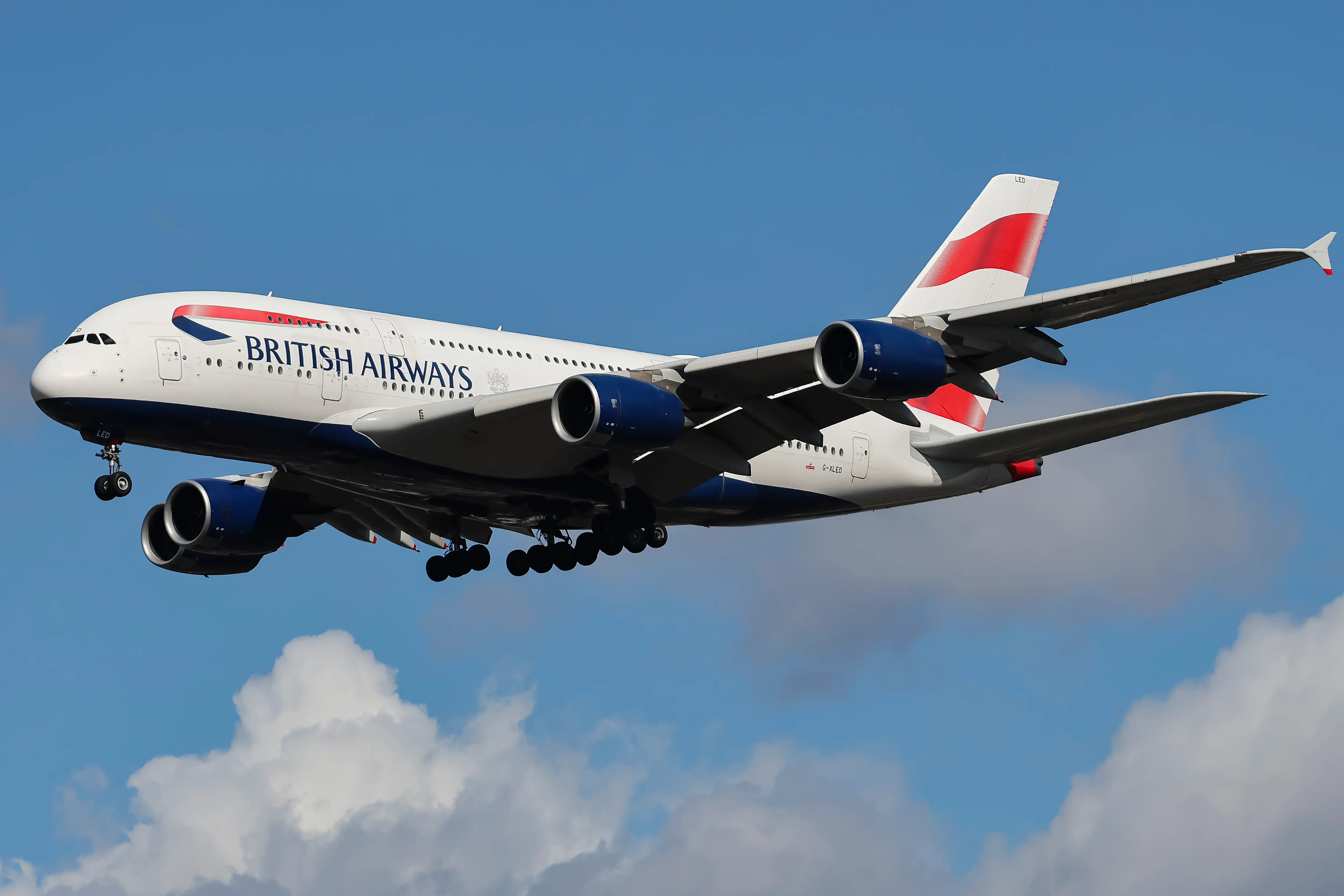 British Airways Airbus A380 Superjumbo passenger aircraft, spotted flying on final approach for landing on London Heathrow Airport runway in the United Kingdom.