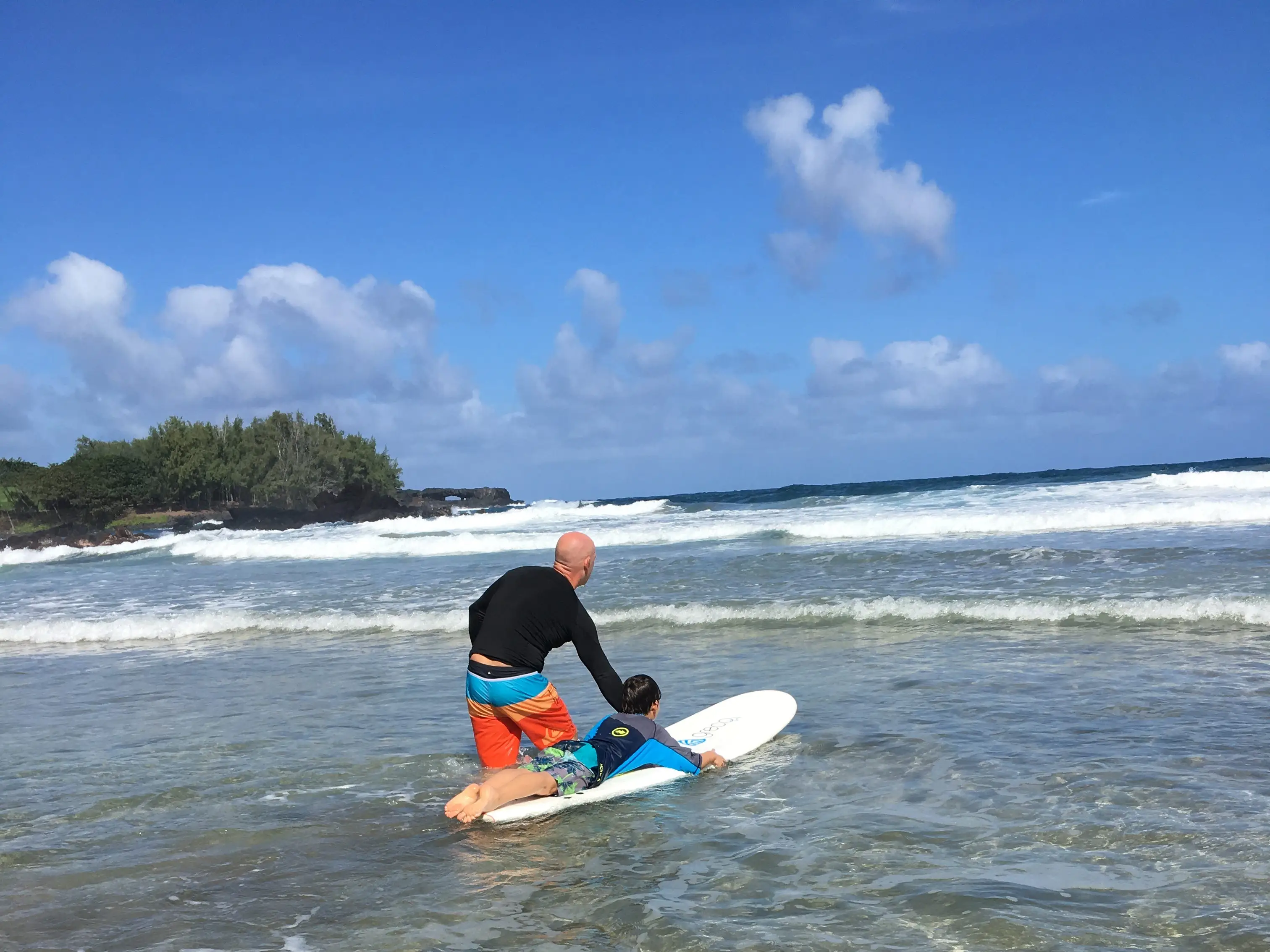 Boy learning to surf