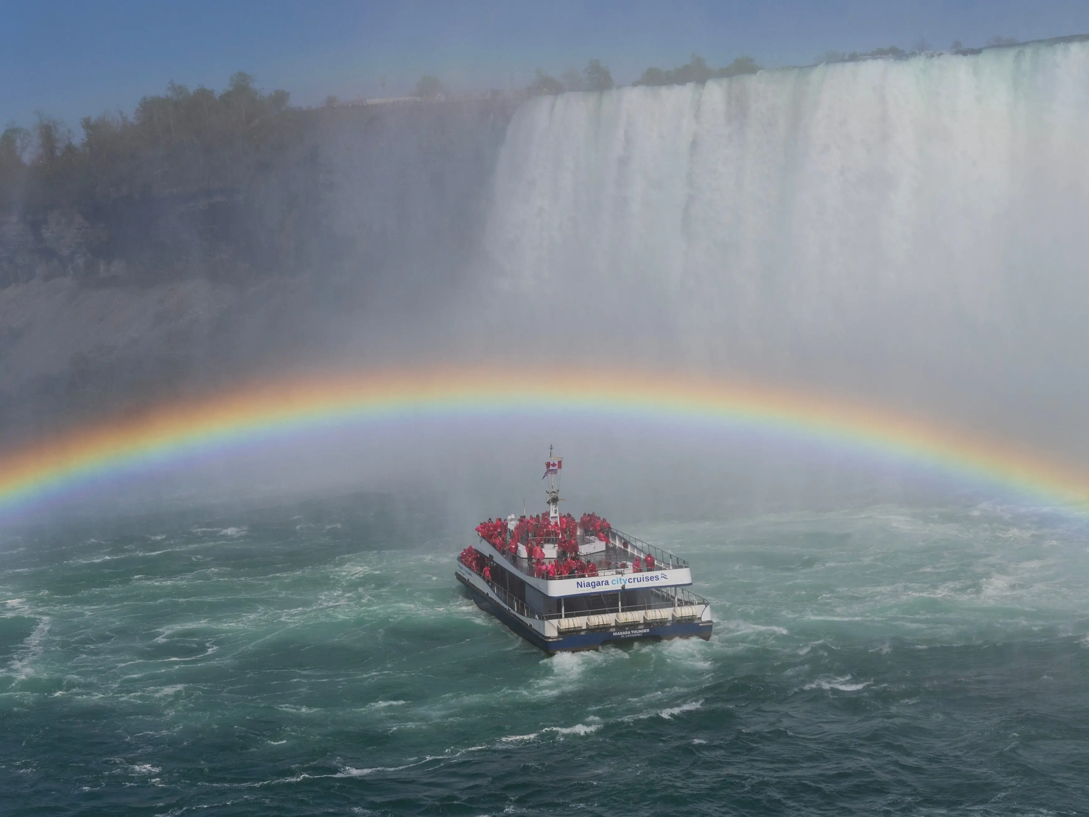 A rainbow over a Niagara City Cruises boat on the Niagara River.