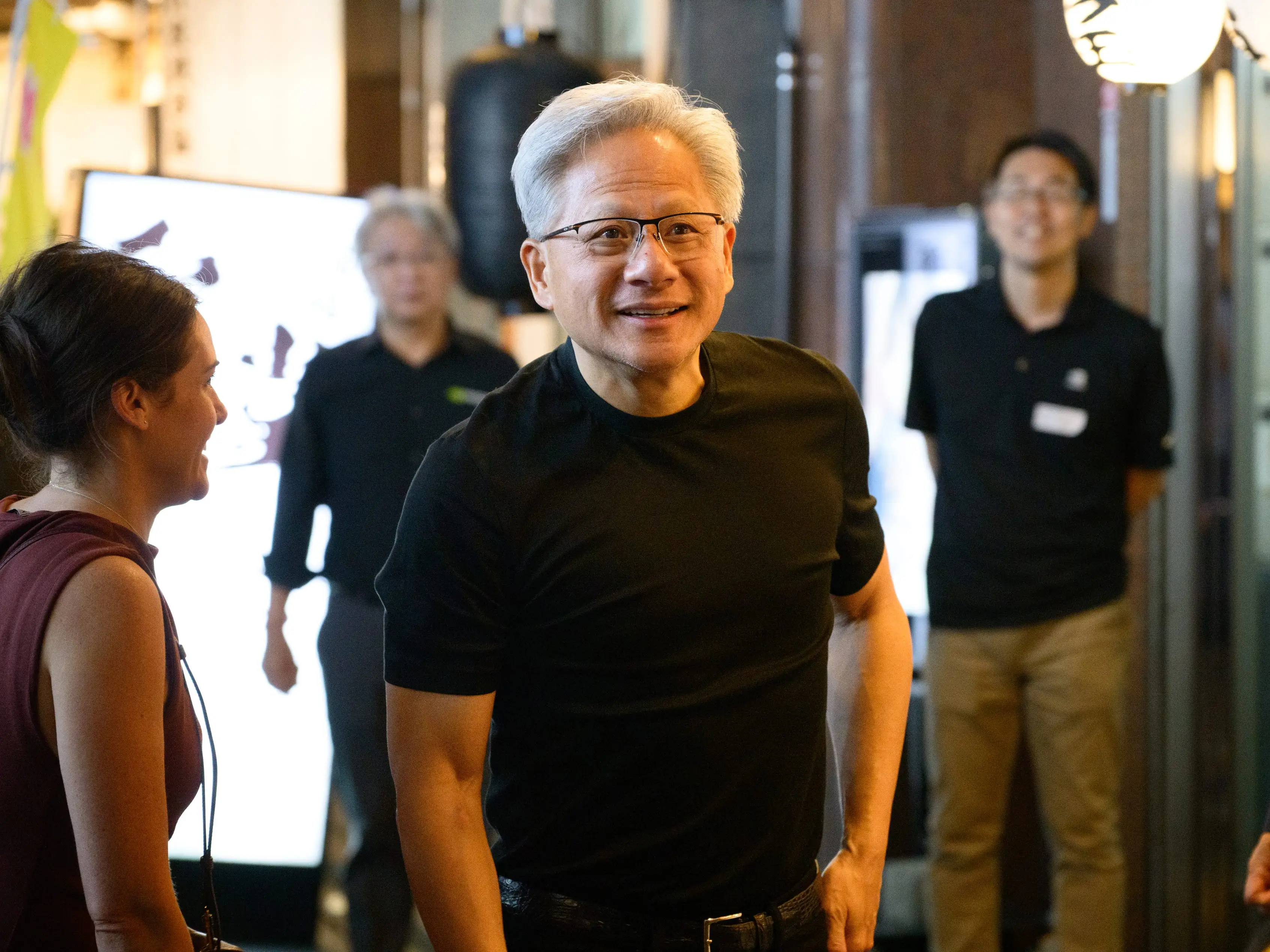Nvidia CEO Jensen Huang leaves a restaurant in Japan.