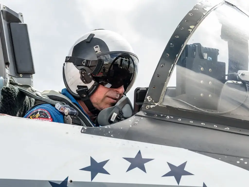 A pilot in the NASA WB-57 with freedom 250 on the side.