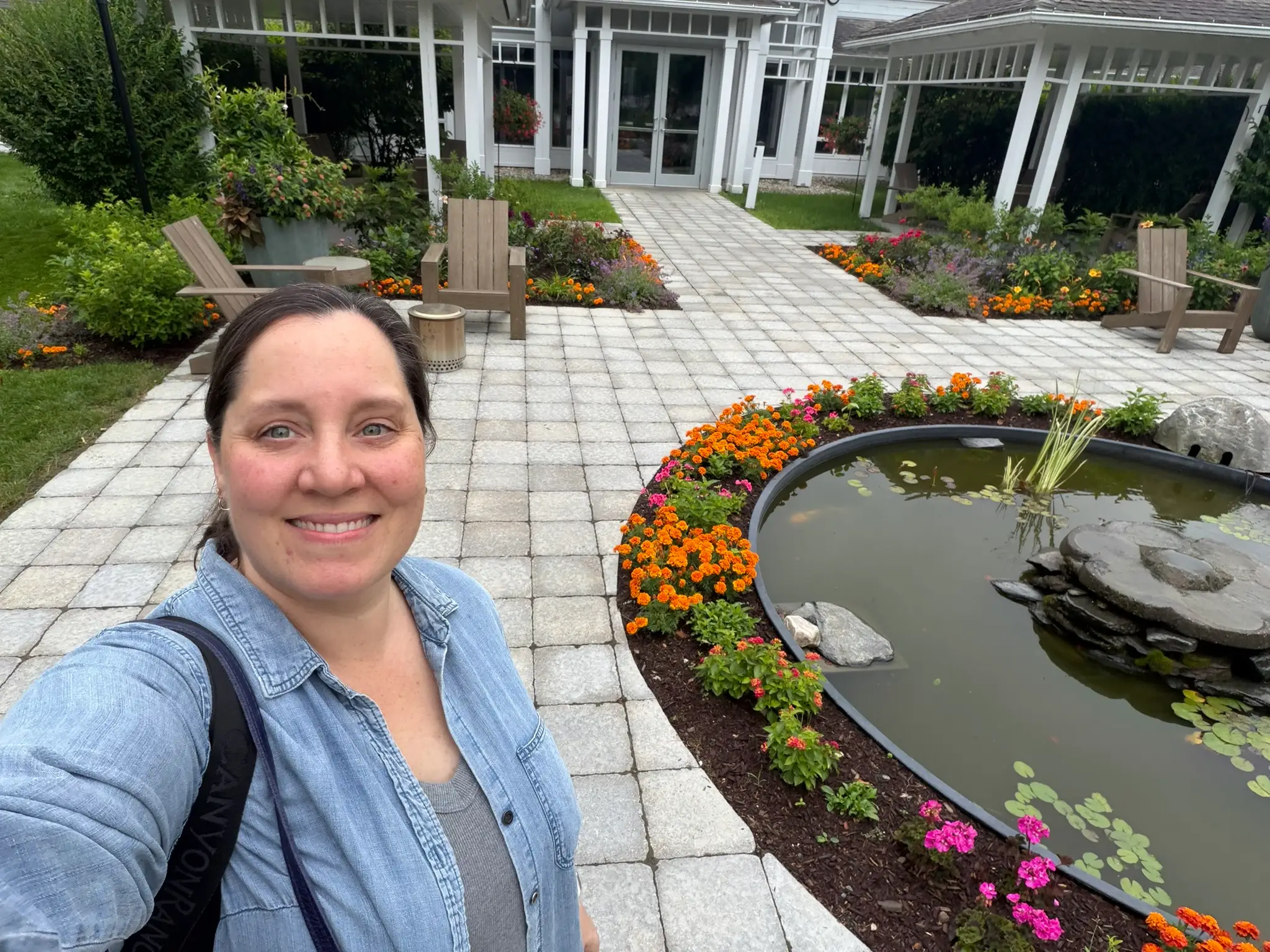Rebecca Hastings in a selfie in front of gardens