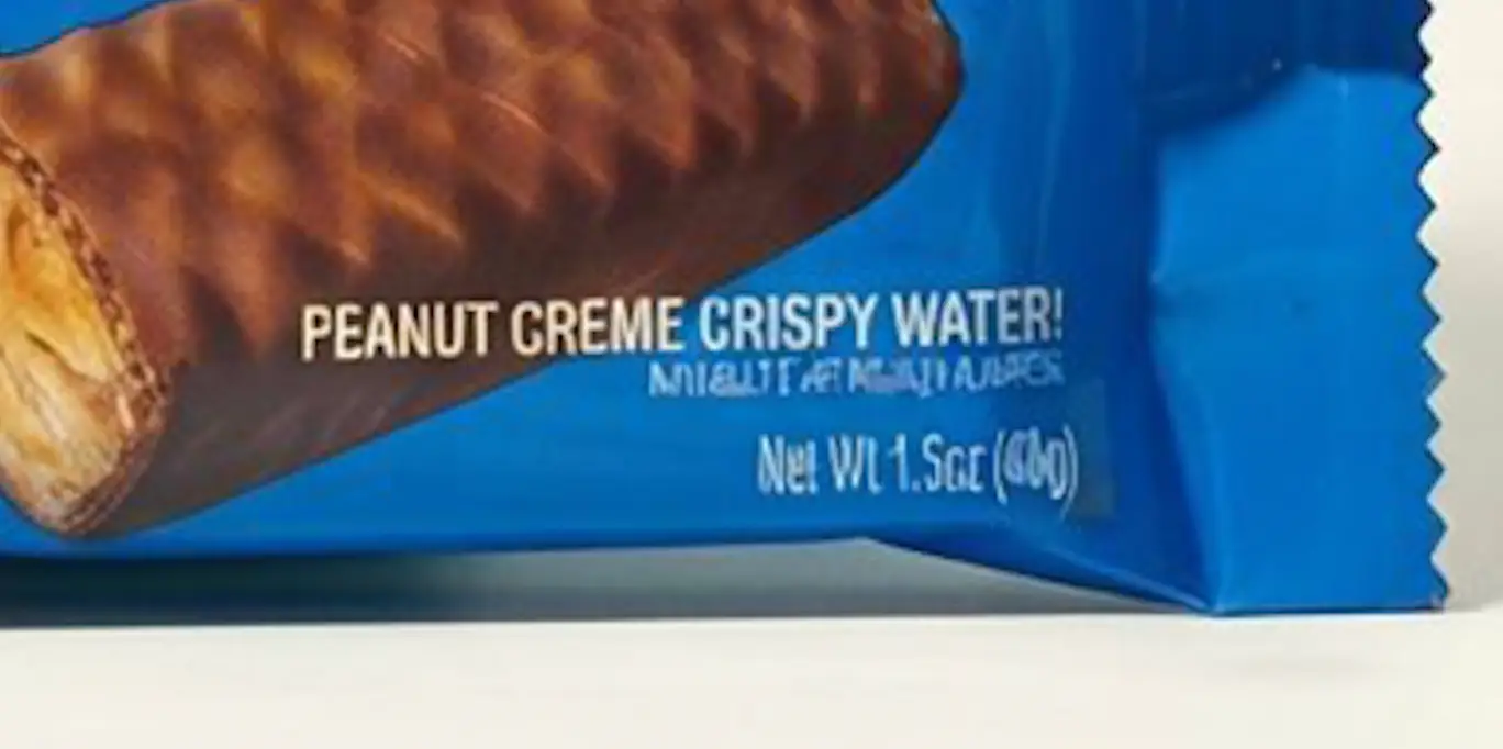 A zoomed-in screenshot of HallPass' advertisement shows blurred letters.