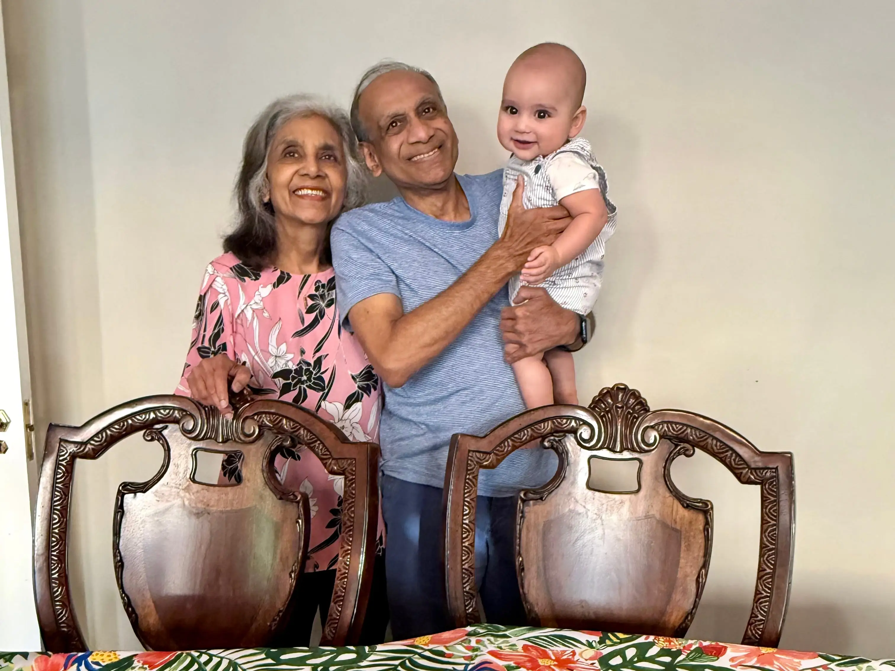 A set of grandparents with their baby grandson.