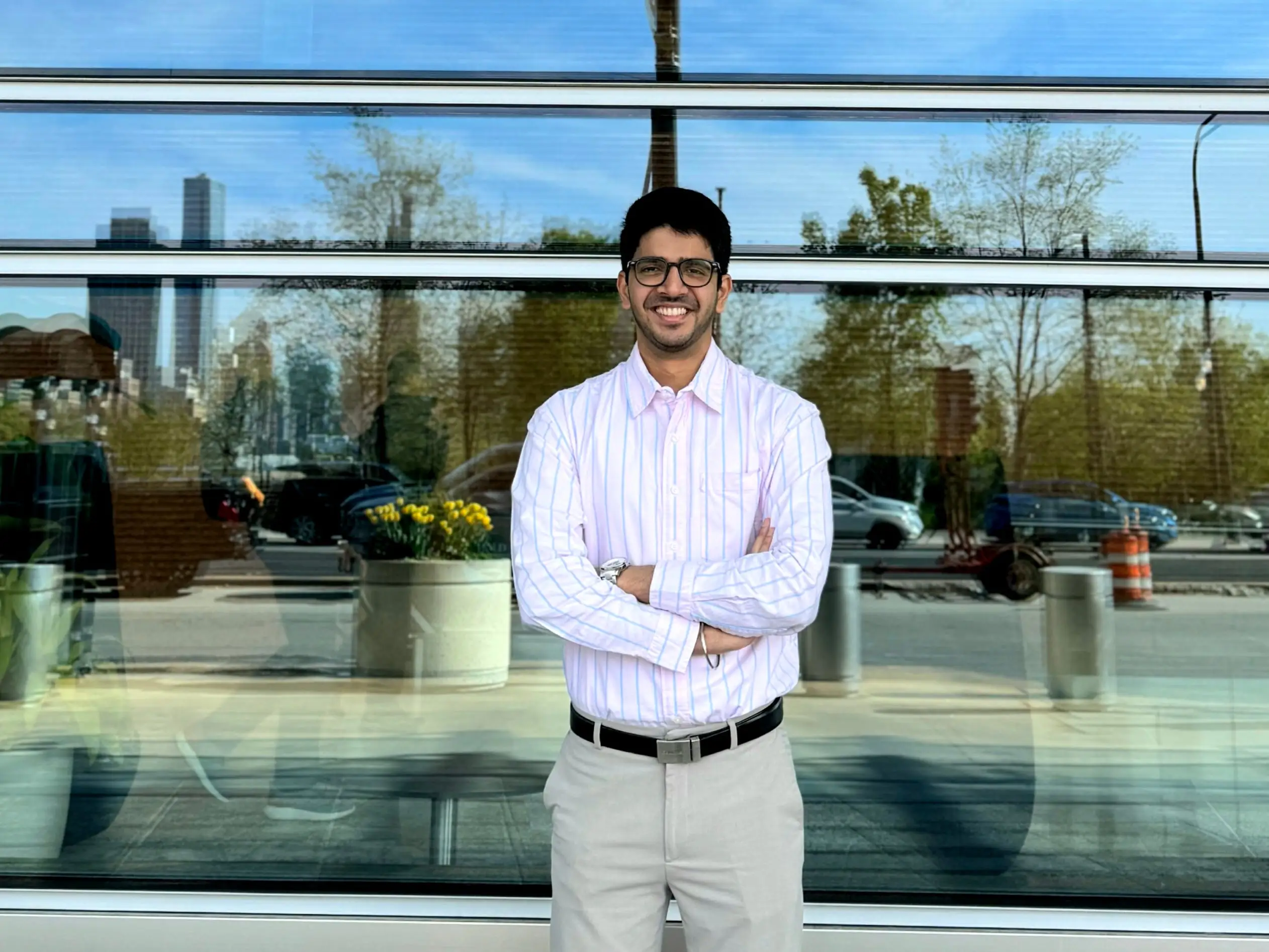 A senior business analyst standing outside the office of Health Care Service Corporation.