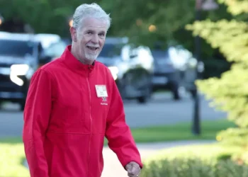 Reed Hastings says AI may push CEOs to cut their workforce in half — or expand their reach
