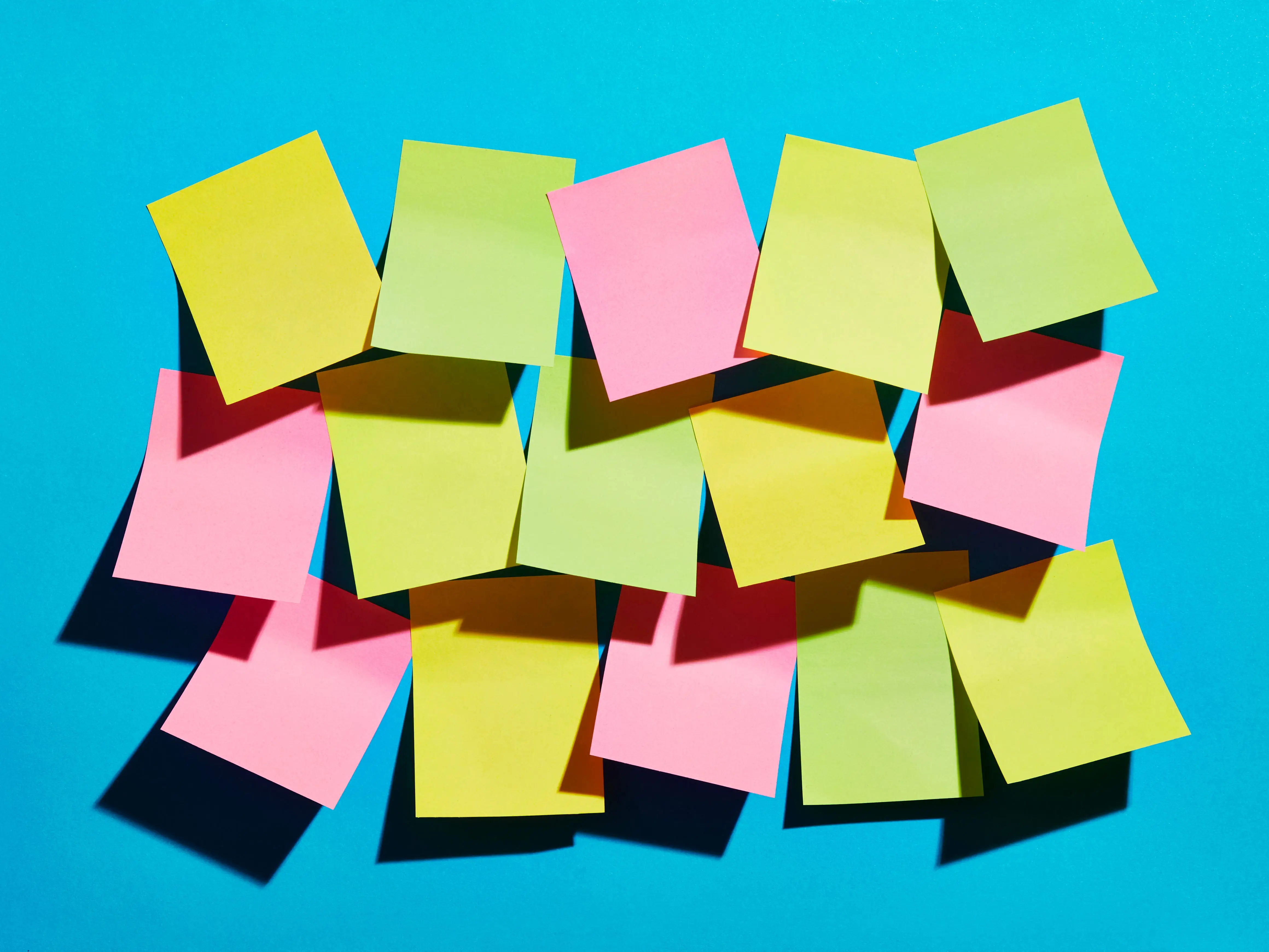 Post it notes against teal background