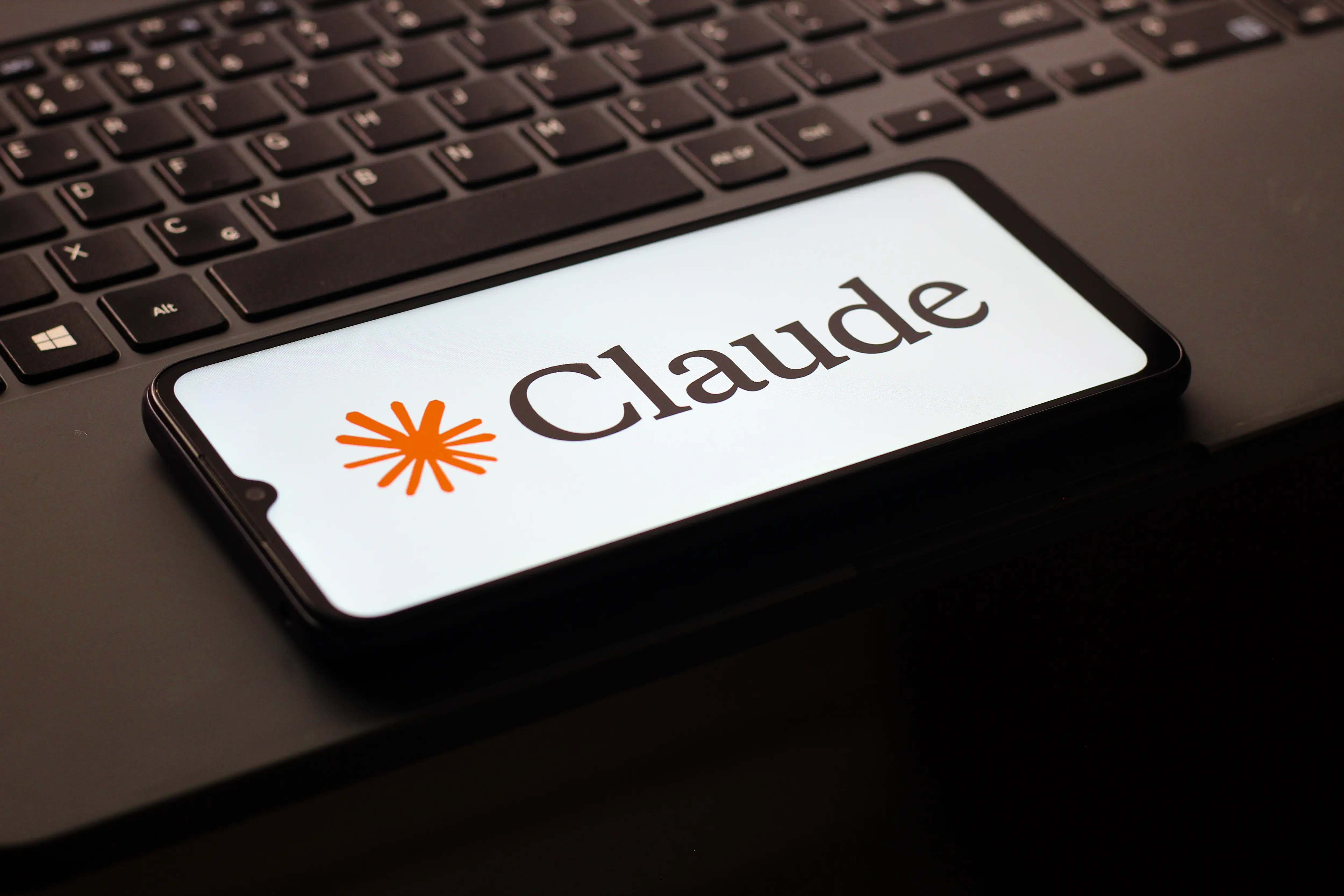 In this photo illustration, the Claude AI logo is seen displayed on a smartphone screen.