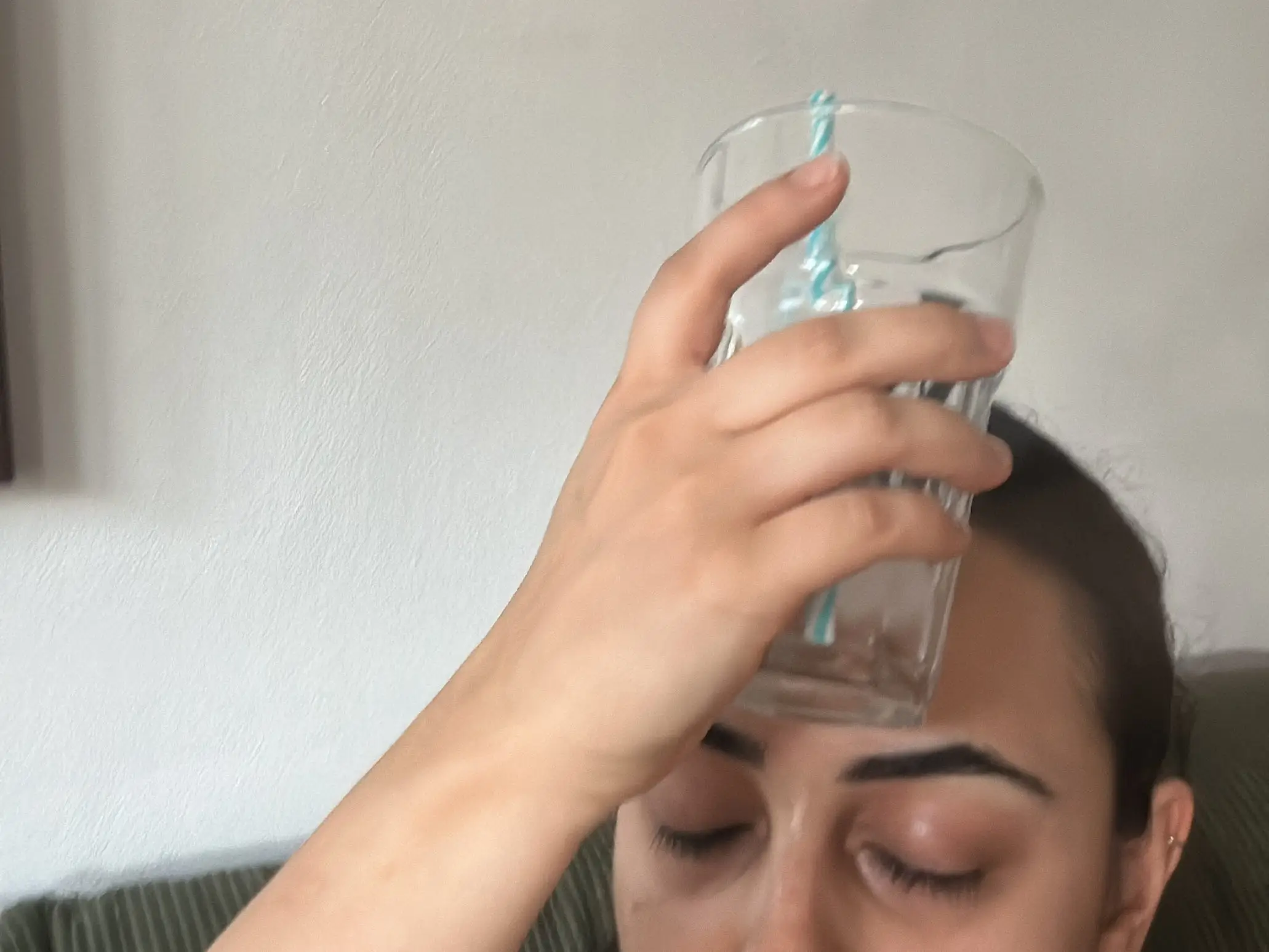 Roya with glass of water on ice in head to stay cool.